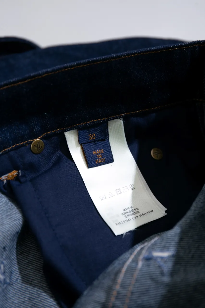 LV Embroidered Jeans This pair of jeans is made of original washed denim, with an all-over LV Blason pattern embroidered with fine yarn. The classic silhouette is finished with a Damier nubuck label and LV metallic accents, making it a sophisticated addition to the matching jacket.  Standard fit All-over LV Blason embroidered Damier nubuck label with LV metallic accents