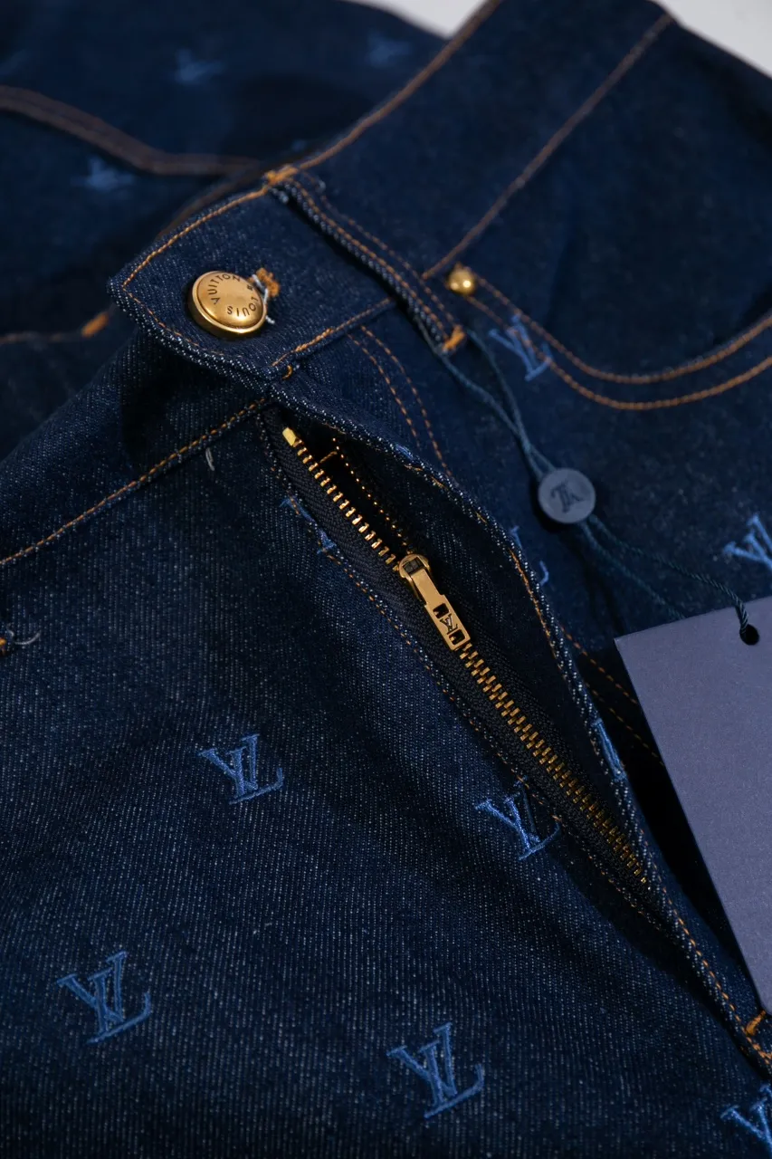 LV Embroidered Jeans This pair of jeans is made of original washed denim, with an all-over LV Blason pattern embroidered with fine yarn. The classic silhouette is finished with a Damier nubuck label and LV metallic accents, making it a sophisticated addition to the matching jacket.  Standard fit All-over LV Blason embroidered Damier nubuck label with LV metallic accents