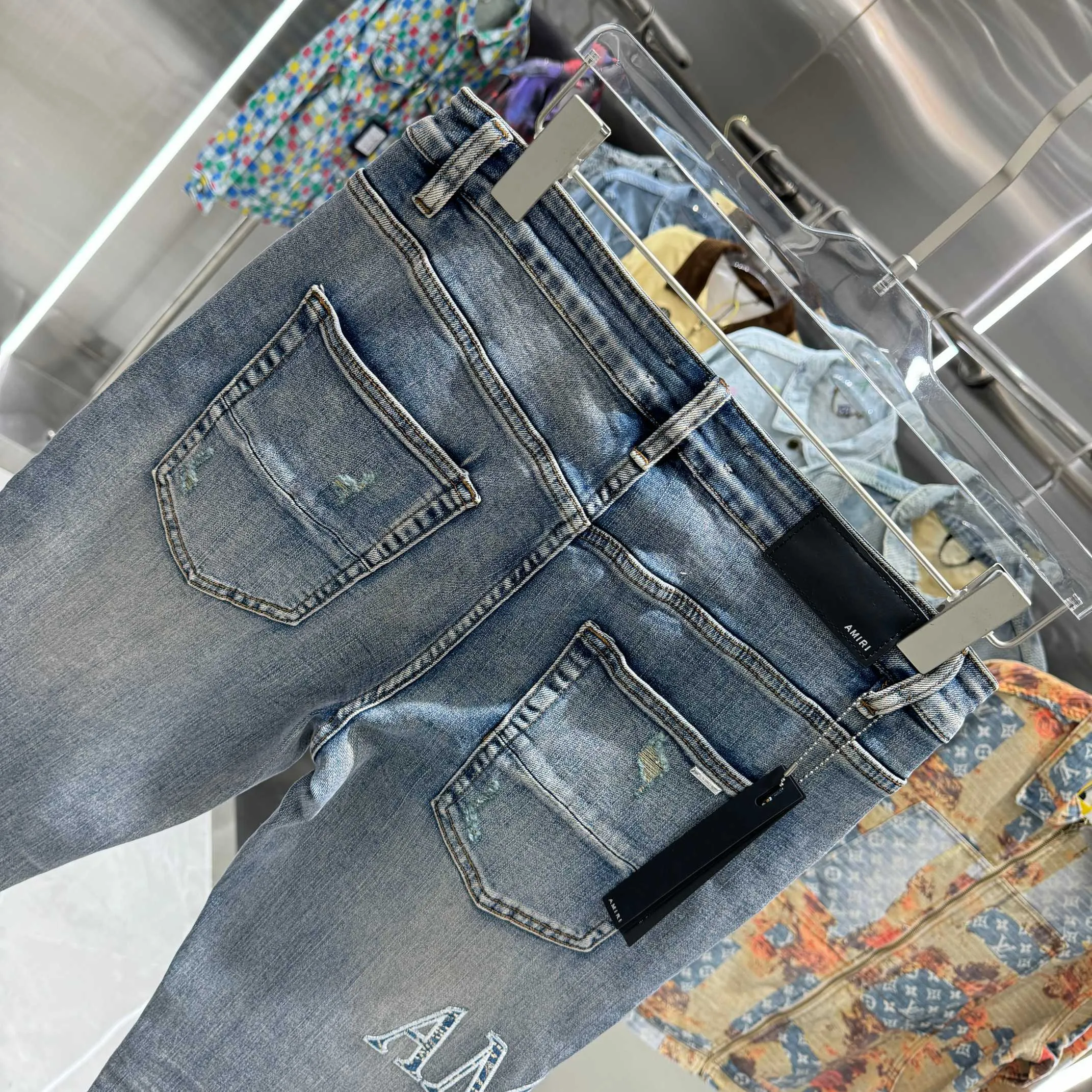 P290 Amiri ripped letter embroidery craft street fashion slim fit stretch jeans color blue size 30 32 34 36 38