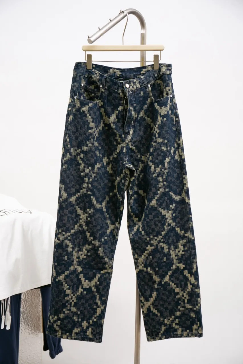Lv Year of the Snake Snake Print Jeans This style of skateboard jeans is made from seasonal Snakoflage denim, and reinterprets the Damoflage pattern with pixel-style snake jacquard. The rear Damier label is embellished with pearlescent buttons and rivets, and can be paired with the matching collarless jacket for an edgy dandy look.  Size: 30 32 34 36