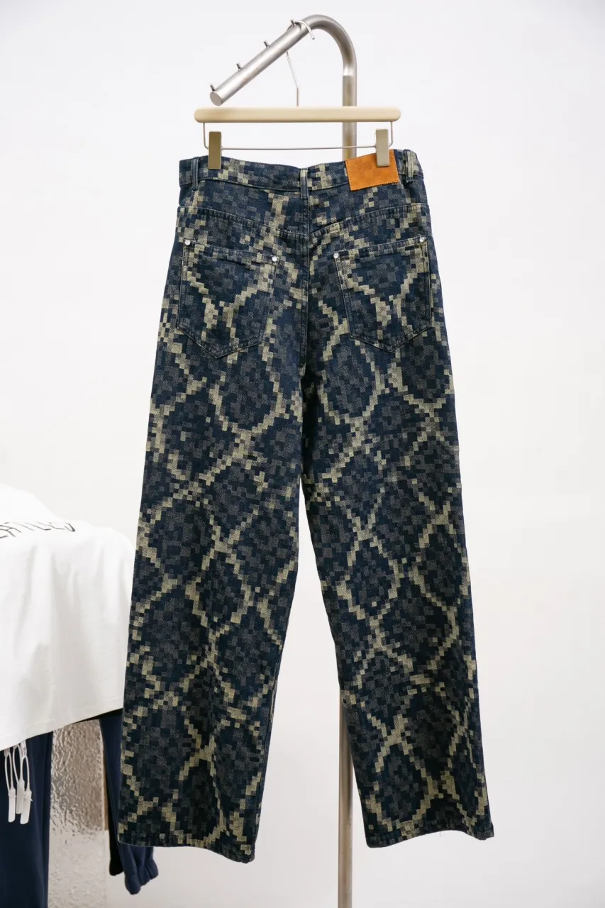 Lv Year of the Snake Snake Print Jeans This style of skateboard jeans is made from seasonal Snakoflage denim, and reinterprets the Damoflage pattern with pixel-style snake jacquard. The rear Damier label is embellished with pearlescent buttons and rivets, and can be paired with the matching collarless jacket for an edgy dandy look.  Size: 30 32 34 36
