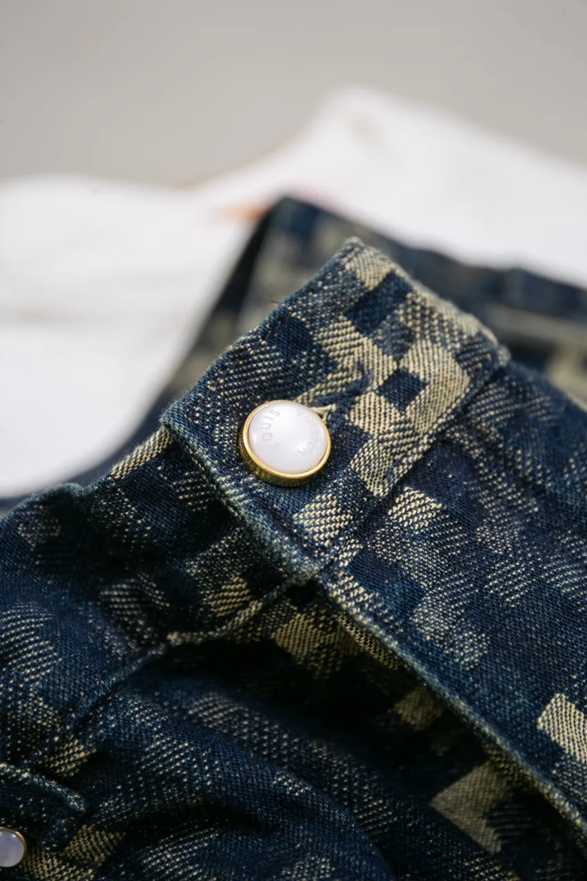 Lv Year of the Snake Snake Print Jeans This style of skateboard jeans is made from seasonal Snakoflage denim, and reinterprets the Damoflage pattern with pixel-style snake jacquard. The rear Damier label is embellished with pearlescent buttons and rivets, and can be paired with the matching collarless jacket for an edgy dandy look.  Size: 30 32 34 36