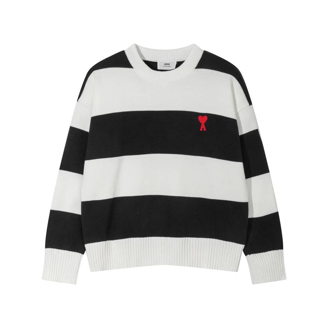 P170 A069# AMI Paris2023 new product. Carefully woven with cotton and wool blended yarn. It has dropped shoulder sleeves and a classic round neck. The blue and white striped body is simple and eye-catching. The red embroidery on the chest easily illustrates the brand identity. Same style for men and women. Color: Black and White, Orchid and White. Size: S-XL.