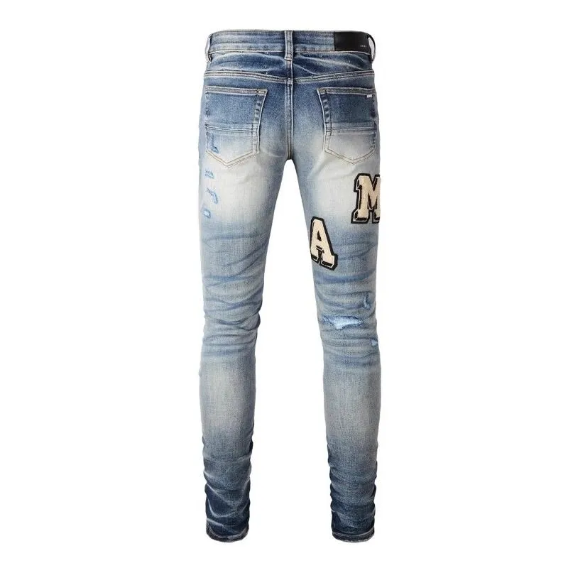 P220 💰 AMIRI patch embroidery jeans trousers AMIRI high street basic ripped tight elastic jeans trousers amiri brand jeans break the production process and cutting of the original jeans, the fabrics are softer and more comfortable Hand-sewn collar label Customized logo buttons Genuine leather tag Color: Picture color Size: 30-32-34-36