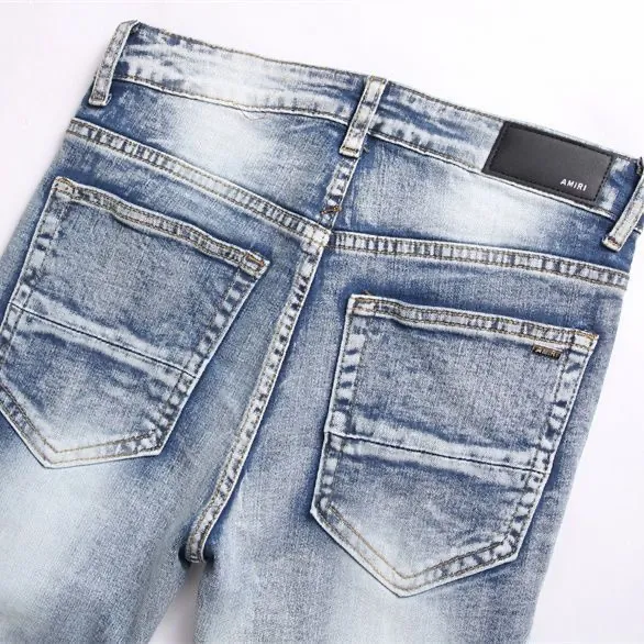 #M45 P168💰 Amiri classic embroidered patched leather distressed lettered jeans. Slim fit jeans. Produced by a major washed factory. Full of high-end. Partial destruction of the knees and patchwork design. Already used as a facade design. Leather waist nameplate. The focus of this style is not on the washing, but on the destroyed shape and version. The secret lies in the craftsmanship of the master. The cost of post-processing, grinding, cutting, etc. is far beyond the cost of assembly line products. Color: Picture color Size: 30-32-34-36