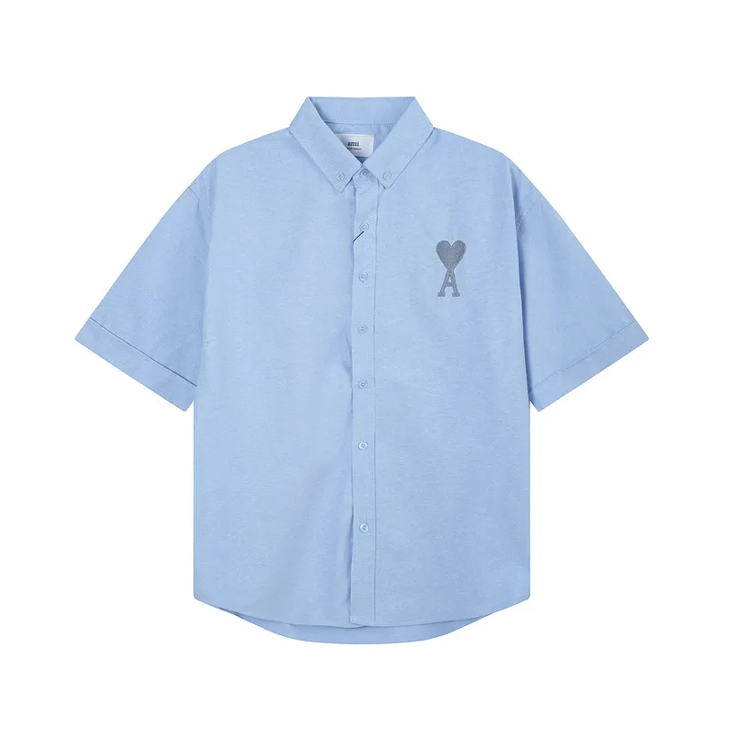 AMI Paris classic autumn heart embroidery in the same color on the chest. Casual cotton solid color short-sleeved Oxford shirt. Original custom-made 180g pure cotton fabric. Loose off-shoulder version. Same style for men and women. Color: Tianlan, white, green, pink, yellow, size: S-XL