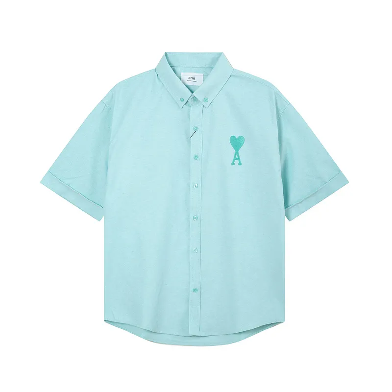 AMI Paris classic autumn heart embroidery in the same color on the chest. Casual cotton solid color short-sleeved Oxford shirt. Original custom-made 180g pure cotton fabric. Loose off-shoulder version. Same style for men and women. Color: Tianlan, white, green, pink, yellow, size: S-XL