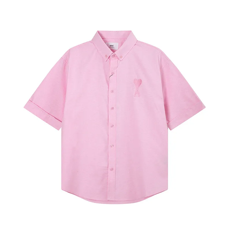 AMI Paris classic autumn heart embroidery in the same color on the chest. Casual cotton solid color short-sleeved Oxford shirt. Original custom-made 180g pure cotton fabric. Loose off-shoulder version. Same style for men and women. Color: Tianlan, white, green, pink, yellow, size: S-XL