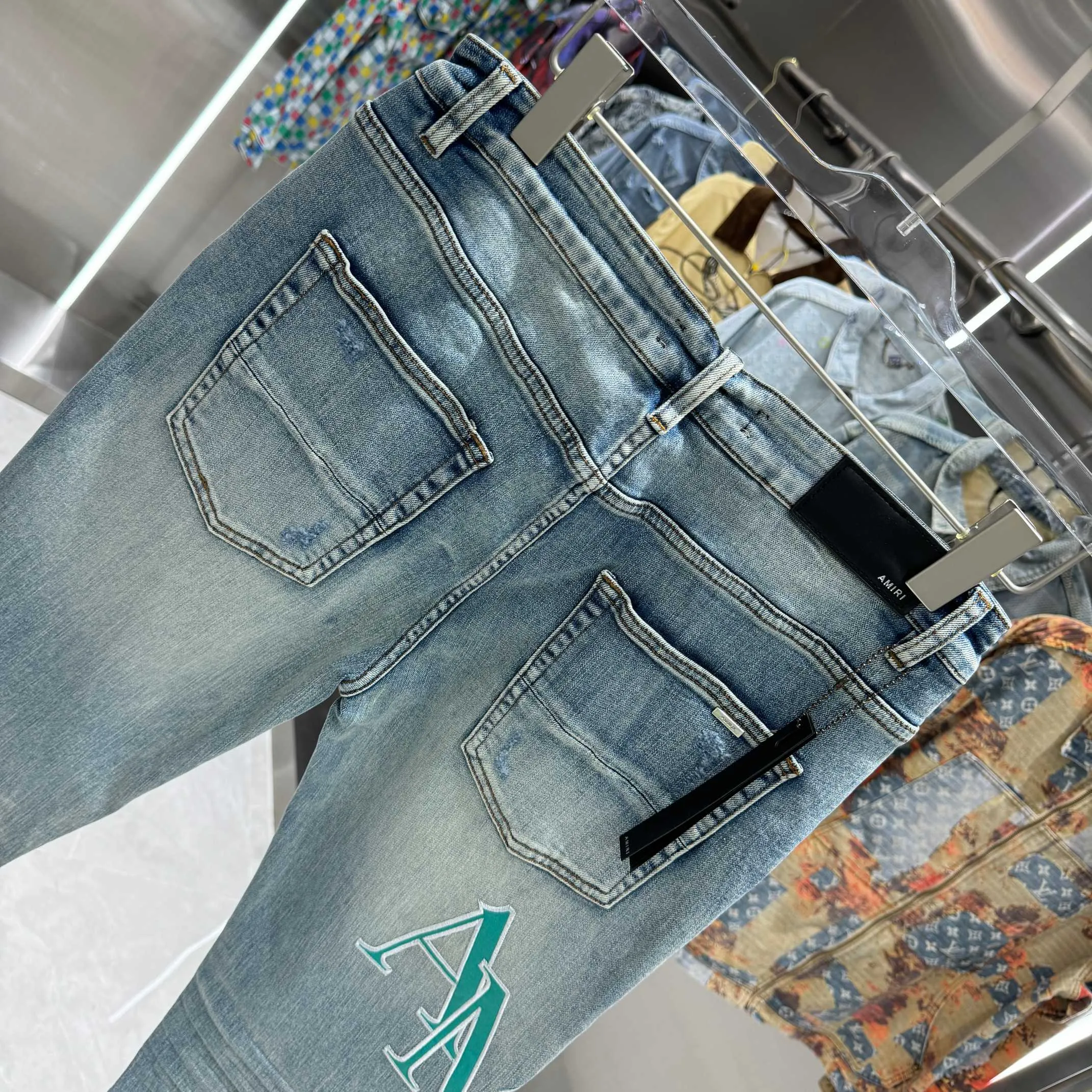 P290 Amiri ripped letter embroidery craft street fashion slim fit stretch jeans color blue size 30 32 34 36 38