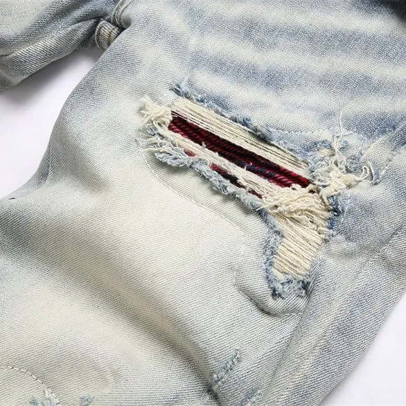 P166 Top replica AMIRI splash-ink medal patch embroidered jeans trousers AMIRI high street basic ripped tight stretch jeans trousers Amiriamiri is transliterated as Emil, which is the name of the founder. Mike Amiri, the founder of amiri, grew up in Los Angeles, USA. He was influenced by the local street culture Rock since childhood, so he founded the amiri brand named after himself. A variety of fashion brand clothing meets the needs of different fashion players. Amiri clothing has novel and unique styles and is a well-known street brand in the United States. Many of its styles and styles are loved by many street photographers. Various clothing styles meet the needs of different people, show their unique temperament, and show the trend of dressing. amiri's jeans are relatively famous. Not only do they have many styles, but the quality of the jeans is also very good. Many celebrities have also worn amiri brand jeans.  The jeans of the amiri brand break through the production process and cutting of the original jeans. The fabrics are relatively soft and comfortable, and are not as hard as some jeans, which can irritate the skin and cause the skin to bleed when worn. Los Angeles trendy brand Amiri's jeans are made with great detail from tailoring to texture, adding wrinkles, bullet holes, damage and other details to add to the trendiness of the jeans. You can choose the style that suits you according to your own needs. Only when you wear a suitable style can you have a certain sense of fashion.  In recent years, high street has become a word that appears more and more frequently in men's clothing. High street style has also become an important direction for everyone's matching. High street related items are basically inseparable from oversize or off-shoulder tops. The lower body is matched with trackpants or tight-fitting denim. In my opinion, the most representative one is perhaps annihilation. Color; picture color Size: m l xl xxl