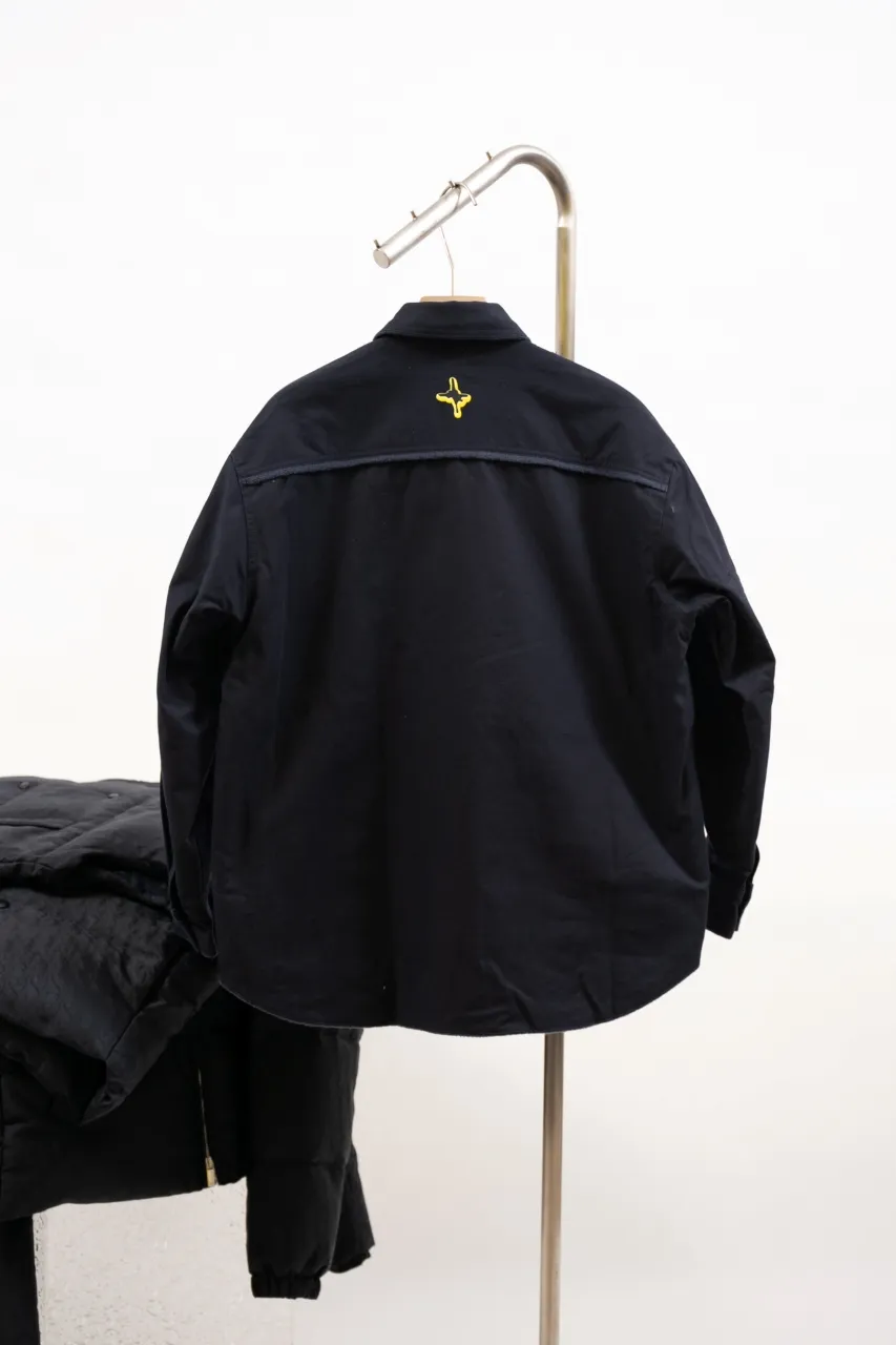 DIOR AND LEWIS HAMILTON Navy blue cotton denim overshirt This overshirt is from the DIOR AND LEWIS HAMILTON limited collection. Crafted from navy blue cotton denim, it features contrasting DIOR AND LEWIS HAMILTON embroidery on the chest and back, a graphic design highlighting Dior's iconic signature. Wear it with the matching jeans for a comfortable, oversized fit. Contrasting DIOR AND LEWIS HAMILTON embroidery on chest and back Button closure and cuffs Chest flap pocket 100% cotton