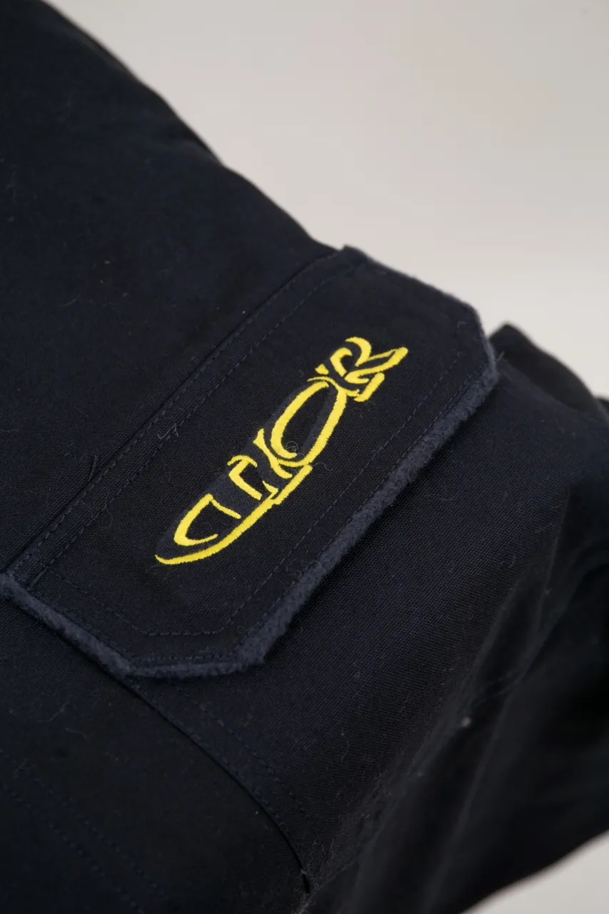 DIOR AND LEWIS HAMILTON Navy blue cotton denim overshirt This overshirt is from the DIOR AND LEWIS HAMILTON limited collection. Crafted from navy blue cotton denim, it features contrasting DIOR AND LEWIS HAMILTON embroidery on the chest and back, a graphic design highlighting Dior's iconic signature. Wear it with the matching jeans for a comfortable, oversized fit. Contrasting DIOR AND LEWIS HAMILTON embroidery on chest and back Button closure and cuffs Chest flap pocket 100% cotton