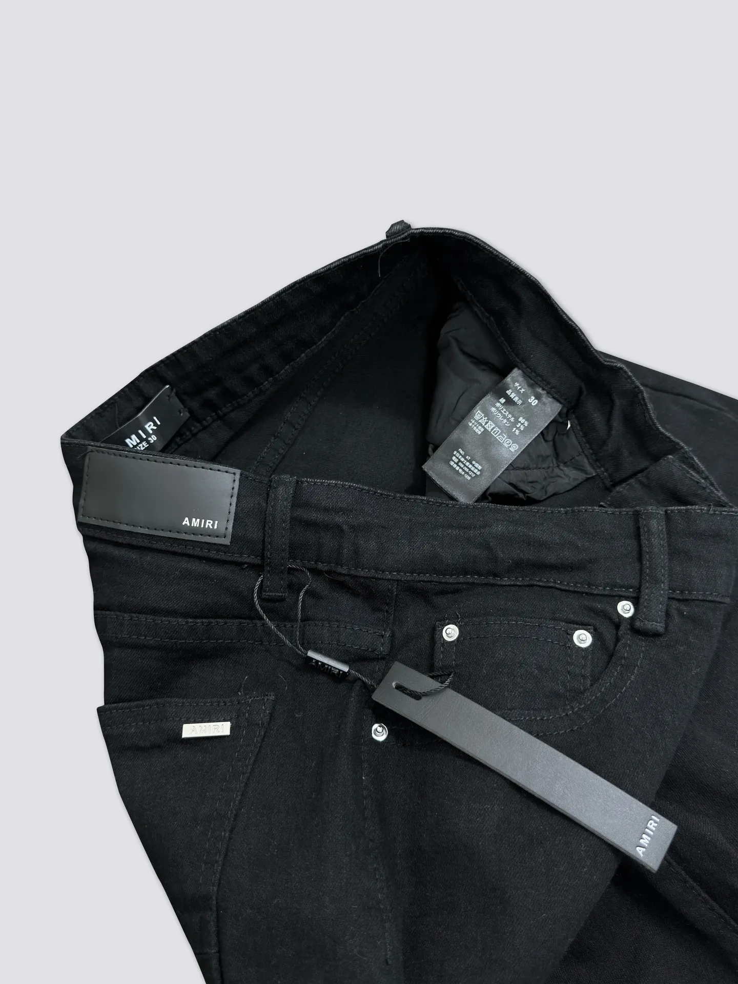 AMIRI's new jeans are washed and splashed with ink, ripped holes and silver diamond denim trousers, the same style for men and women. Color: black. Size: S-XL (28-34)