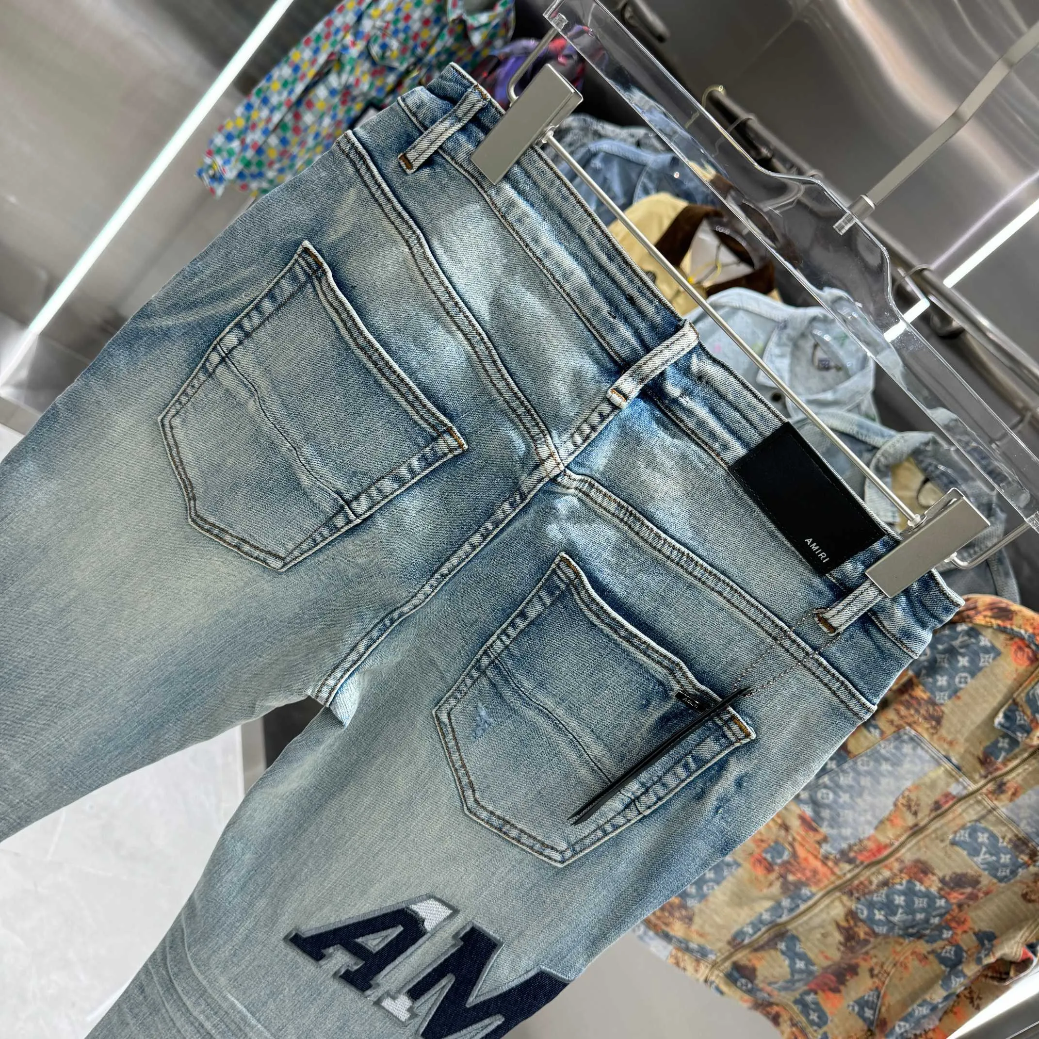 P290 Amiri ripped letter embroidery craft street fashion slim fit stretch jeans color blue size 30 32 34 36 38