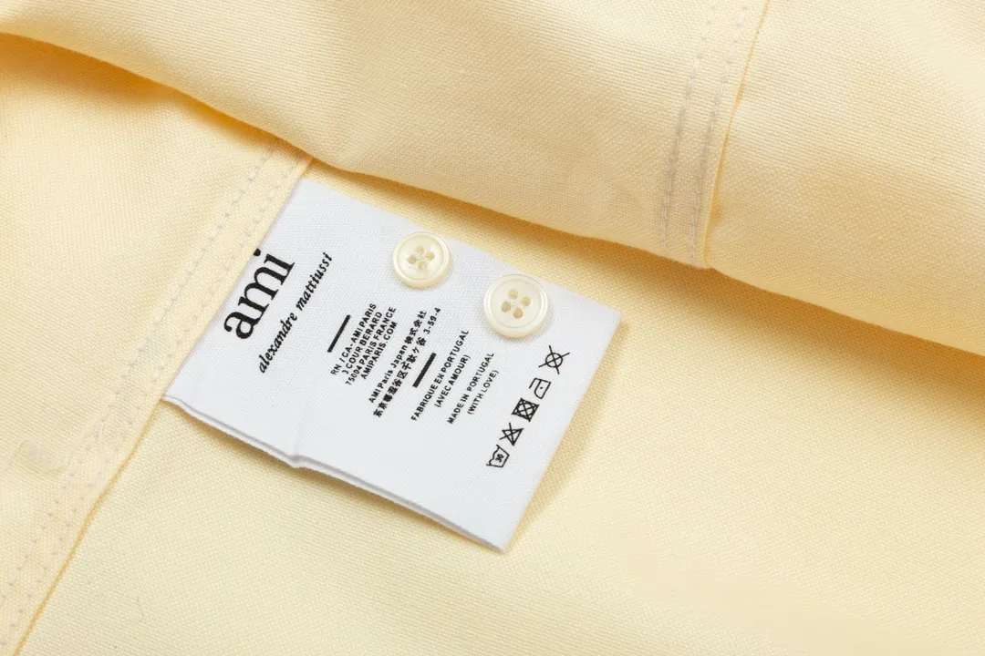 2203# AMI Paris Classic autumn red small love heart embroidery on the chest Casual cotton solid color long-sleeved Oxford shirt Original custom-made 180g pure cotton fabric Regular version Same style for men and women Color: White Blue Yellow Brown Pink Size: S-XL