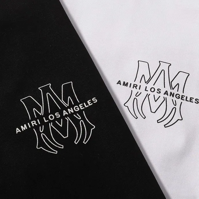 Style number: 724 P126 Fabric: 260g double yarn AMIRI 2025 spring and summer new logo round neck T-shirt high street men and women loose classic letter cashew flower short sleeves Color: black. White Size: S M L XL