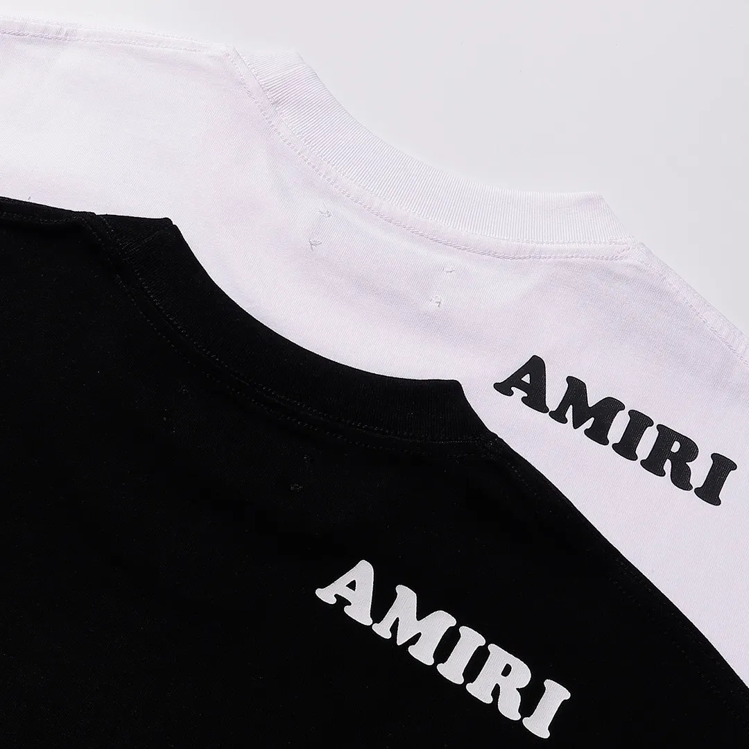 Style number: 748 P114 Fabric: 260g double yarn AMIRI 2025 spring and summer new logo round neck T-shirt high street men and women loose classic letter printed short sleeves Color: black. White Size: S M L XL