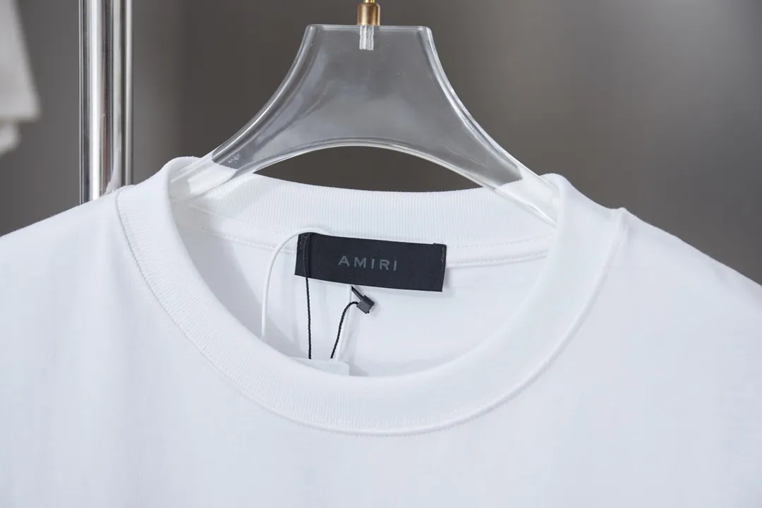 P150 AMIRI 25SS early spring new style short sleeves with embroidered letters, light luxury, a must-have item for daily commuting for men and women, correct version, welcome to compare, detailed features · 320g 100% pure cotton double yarn jersey fabric · Special thickened 32 pieces of double-strand 1X1 thread in the same vat custom dyeing · Imported Tajima machine embroidery color hollow show. Garment washing water: ㊗️ Washing water is to make the embroidery softer · Double-needle sewing and cross-seam technology · Original main mark, washed tag, brand moisture-proof paper packaging Color: black/white Size: S/M/L/XL