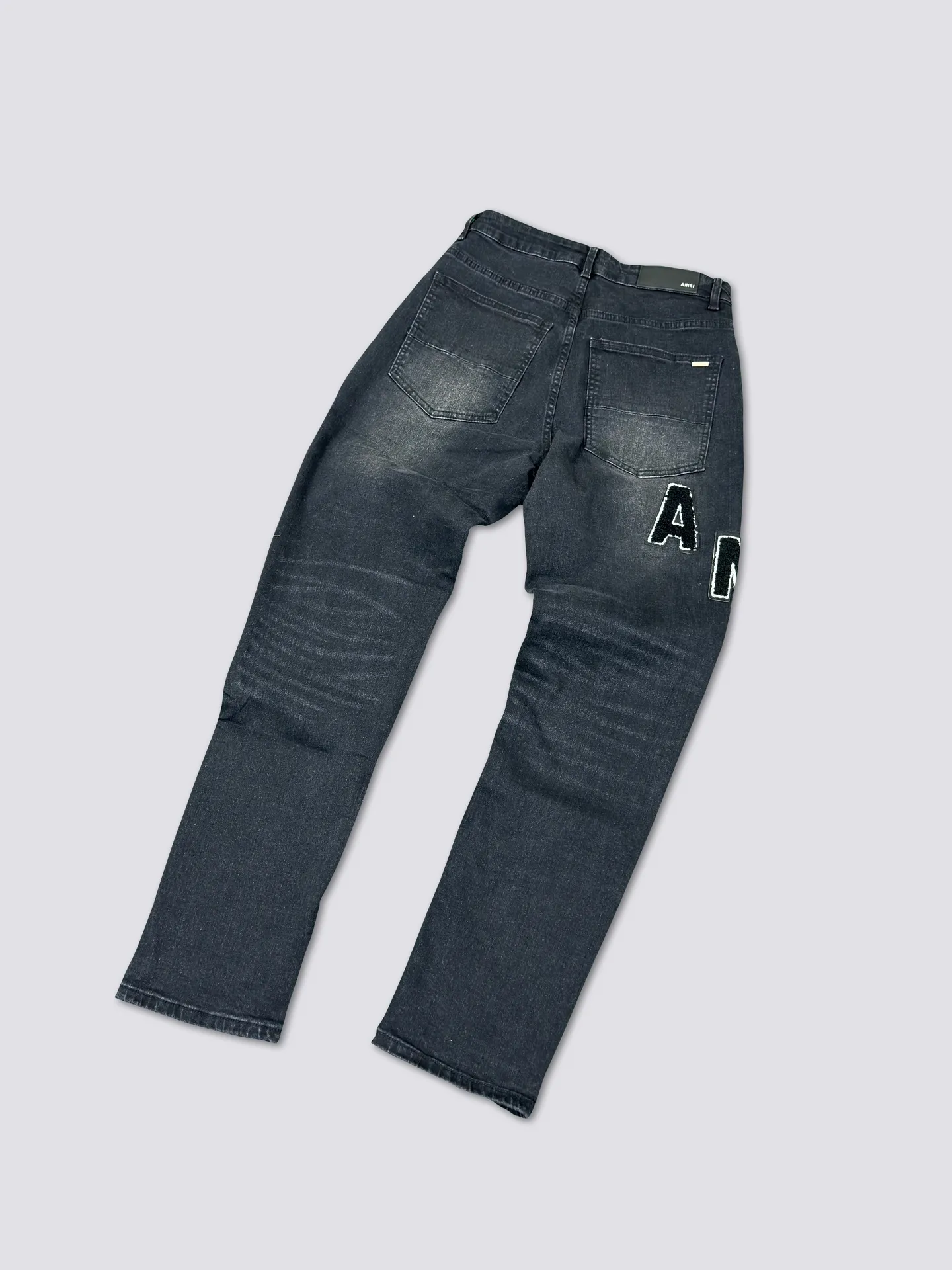 AMIRI's new jeans washed towel embroidered logo denim trousers are the same for men and women Color: Black Size: S-XL (28-34)