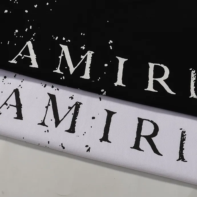 Style number: 713 P126 Fabric: 260g double yarn AMIRI 2025 spring and summer new logo round neck T-shirt high street men and women loose classic letter splash ink short sleeves Color: black. White Size: S M L XL