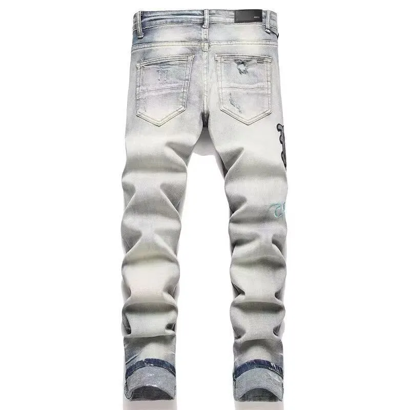 #M56 P168💰 AMIRI patch embroidery jeans trousers AMIRI high street basic ripped tight elastic jeans trousers amiri brand jeans break the production process and cutting of the original jeans, the fabrics are softer and more comfortable Hand-sewn collar label Customized logo buttons Genuine leather tag Color: Picture color Size: 30-32-34-36