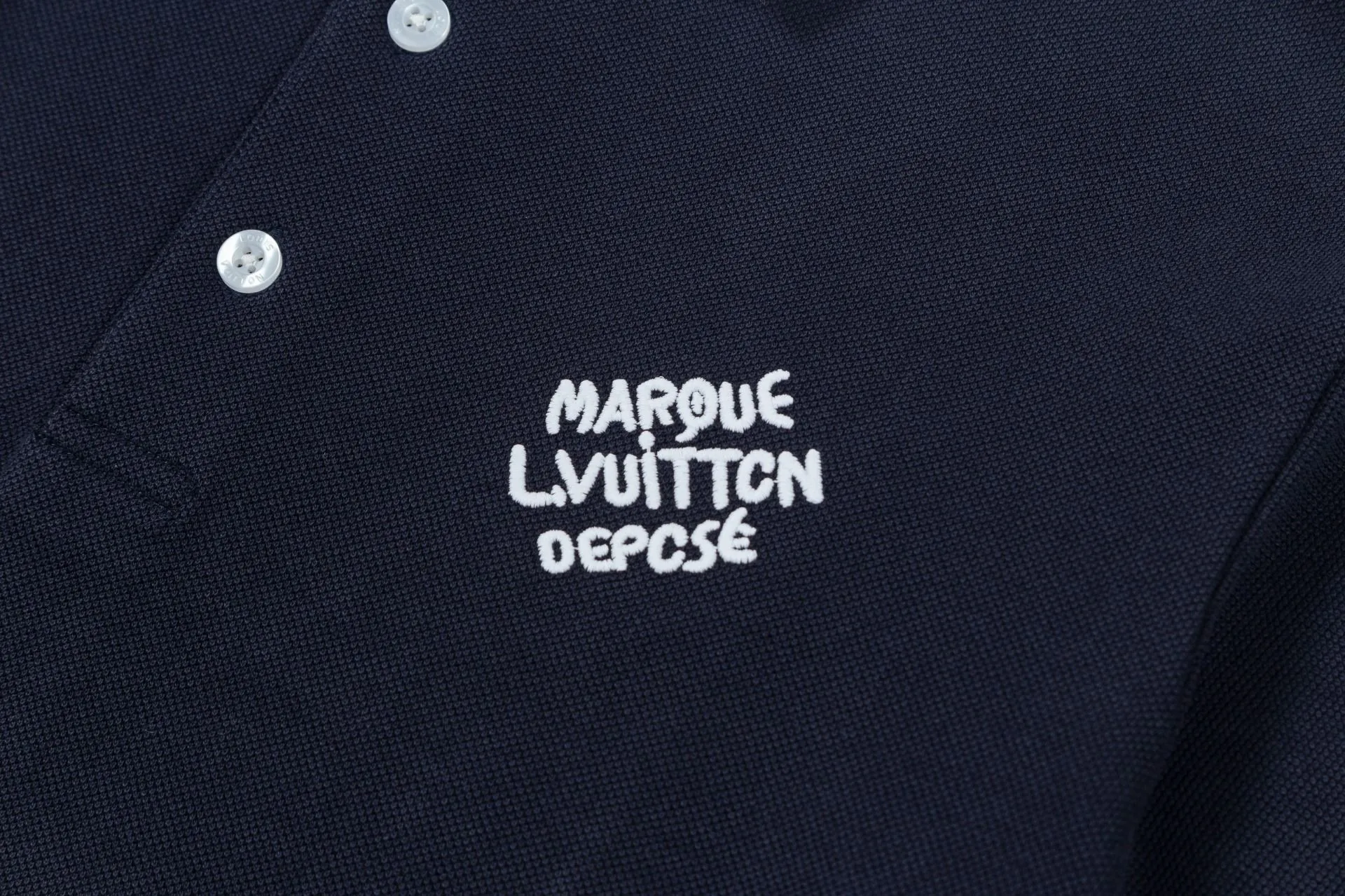 Brand: LV Weight: 270 Color: Blue Black Size: M-XXL Original customization 1:1 restoration Embroidery technology Pure cotton mercerized piqué This polo shirt is made of piqué cotton with a subtle full-width Damier jacquard texture, and the Marque L.Vuitton déposée logo embroidery lights up the sight. Pearlescent buttons add dandy style and can easily be incorporated into everyday looks.  •Regular fit •Damier jacquard pique •Marque L.Vuitton déposée embroidery on chest •Button placket at front •Pearl buttons with LV logo on top button •Ribbed collar and cuffs •100% cotton