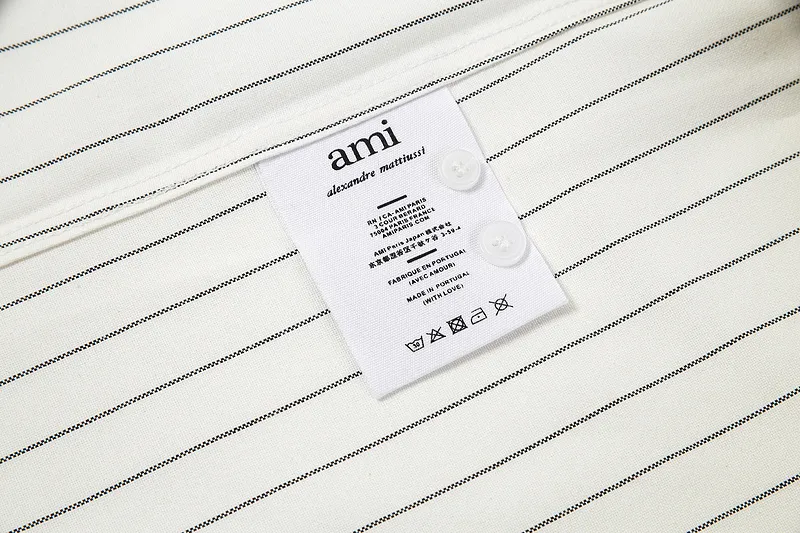 AMI Paris classic autumn red love heart embroidered on the chest. Casual cotton large striped short-sleeved Oxford shirt. Original custom-made 180g pure cotton fabric. Loose off-shoulder version. Same style for men and women. Color: black and white, blue and white. Size: S-XL.