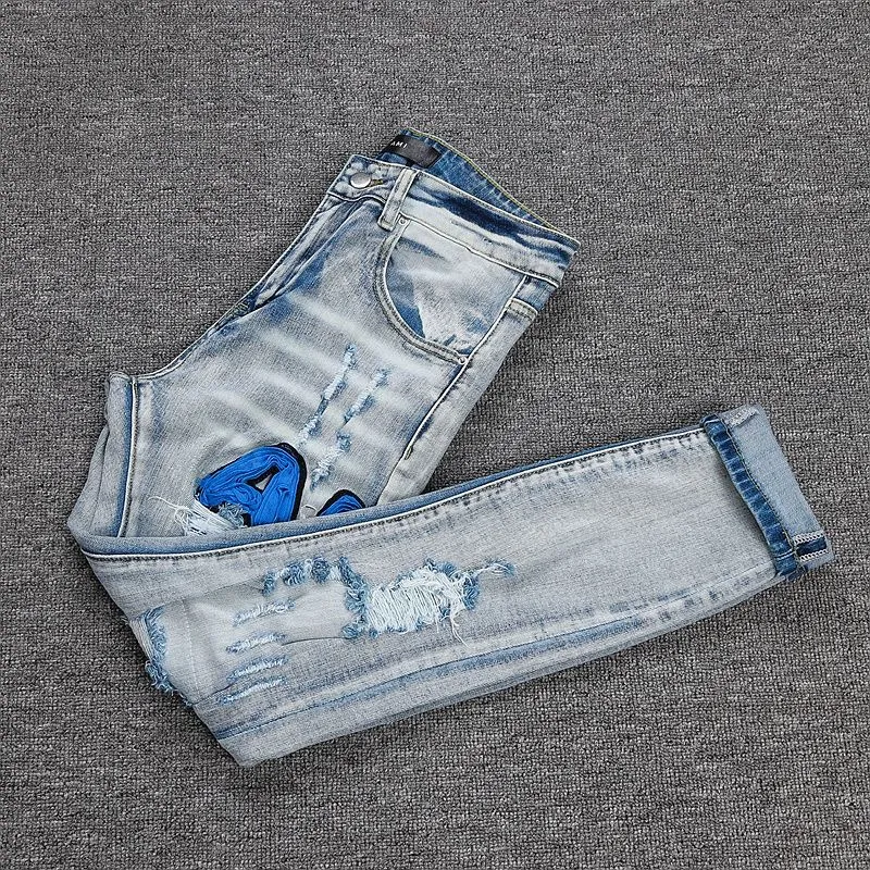 P270 💰 (Top Version) AMIRI Double Buff High Street Jeans Slim Fit Stretch Washed Knife Cut Hole Pants Men's Fashion AMIRI amiri is transliterated as Emil, which is the name of the founder. Mike Amiri, the founder of amiri, grew up in Los Angeles, USA. He was influenced by local street culture and Punk Rock since childhood, so he founded the amiri brand named after himself. A variety of trendy clothing meets the needs of different fashion players. Amiri clothing has novel and unique styles and is a well-known street brand in the United States. The styles and styles of many clothes are loved by many street photographers. The various clothing styles meet the dressing needs of different people, show their unique temperament, and show the trend of dressing. amiri's jeans are relatively famous. Not only do they have many styles, but the quality of the jeans is also very good. Many celebrities have also worn amiri brand jeans. Color: Picture color Size: 28, 30, 32, 34, 36 28 30 32 34 36 Waist 71 76 81 86 91 Qianlang 26.5 27.5 28.5 29.5 30.5 Hou Lang 37 38 39 40 41 Foot 14 14.8 15.6 16.4 17.2 Foreign Minister 100 102 104 106 107