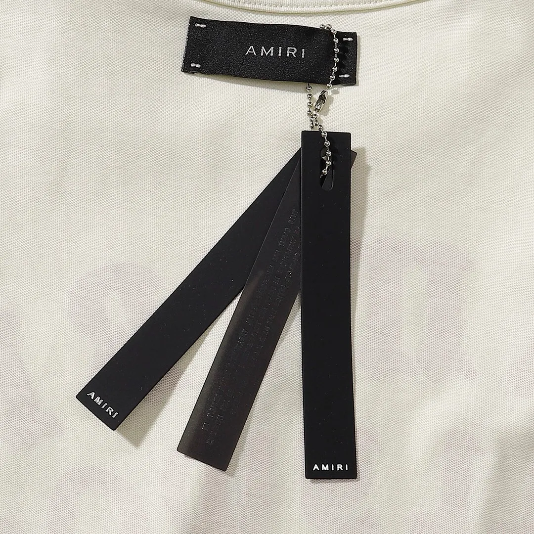 Style number: 749 P114 Fabric: 260g double yarn AMIRI 2025 spring and summer new logo round neck T-shirt high street men and women loose classic letter printed short sleeves Color: black. Apricot Size: S M L XL
