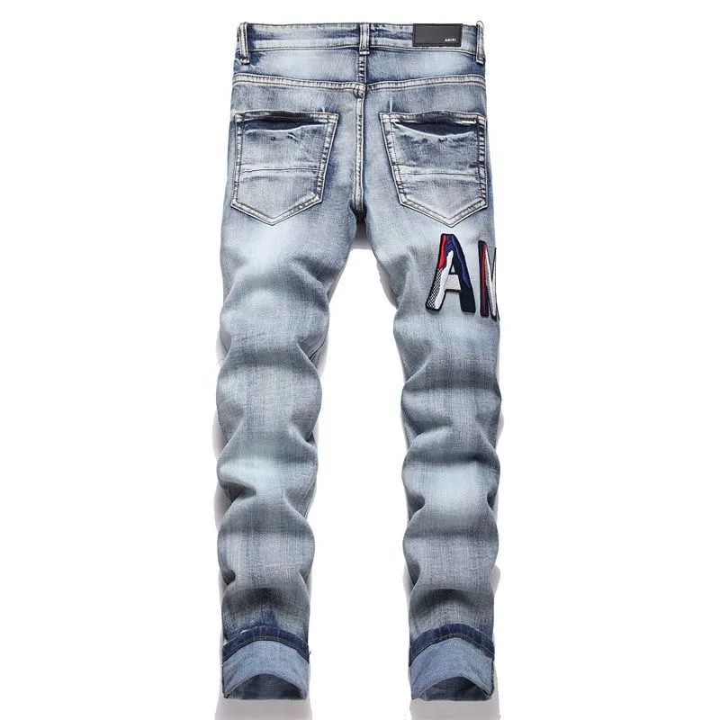 P168 💰 AMIRI patch embroidery jeans trousers AMIRI high street basic ripped tight elastic jeans trousers amiri brand jeans break the production process and cutting of the original jeans, the fabrics are softer and more comfortable Hand-sewn collar label Customized logo buttons Genuine leather tag Color: Picture color Size: 30-32-34-36