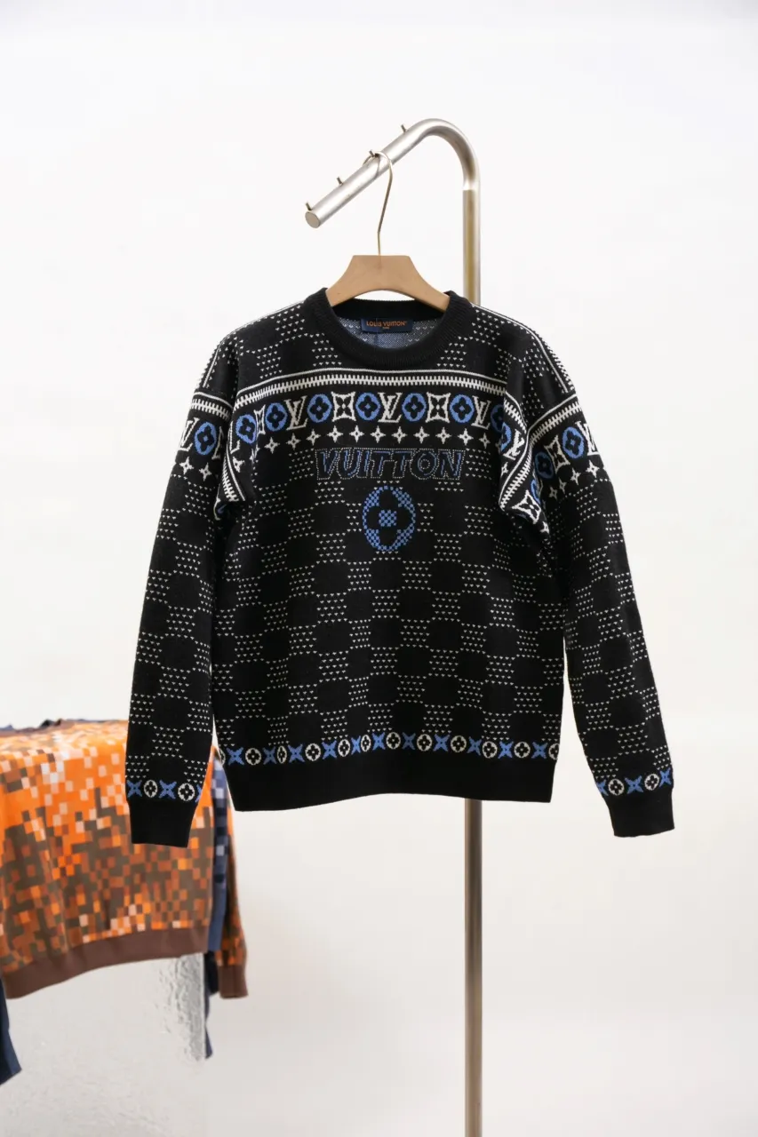 LV Jacquard Sheep Wool Pullover Sweater This pullover is made from responsibly sourced sheep wool. It outlines the classic pattern and the brand's logo jacquard texture on a deep background, and then reinvents the Fair Isle sweater with a soft dropped shoulder design. Wear it over a ski jacket or light up the campfire.  Standard fit All-over LV Fair Isle jacquard with Damier and Monogram details Vuitton logo jacquard in the center