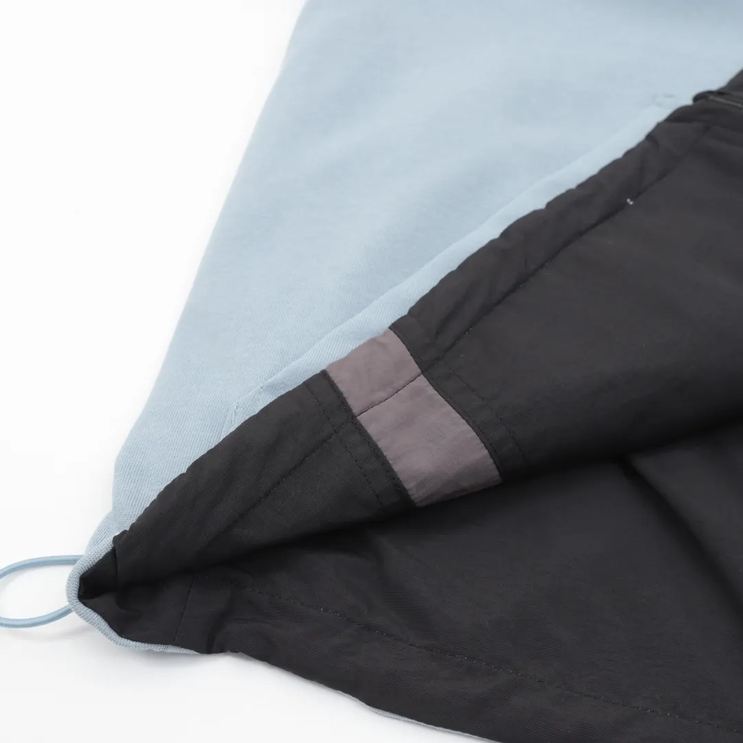 🅿️620 Balenciaga x Under Armor Balenciaga BLCG × UA 25SS cross-border co-branded haze blue reversible jacket Light luxury essential item for daily commuting for men and women Correct version Free comparison Detailed features · Customized matte Taslan jacket fabric · The entire fabric is pre-treated with a waterproof coating · OS ultra-loose silhouette design · The reverse side is made of custom-dyed 360g double-yarn pure cotton terry fabric · Custom-dyed cotton matte tatami embroidery thread · Imported Tajima high-speed embroidery machine high-density machine embroidery, three-dimensional and full · Side zipper pockets hooded design · The reverse side of the sweatshirt is designed with a sweatshirt rat bag · The cuffs are designed with elastic elasticity · The hem is designed with elastic spring buckles to tighten the waist · Open mold customization hardware zipper spring buckle Customized logo hood cord · Zippered pockets on the side of trousers · Three-grade polyester bird’s eye mesh lining · Original main mark washed tag packaging Color: Black Size: 46-52