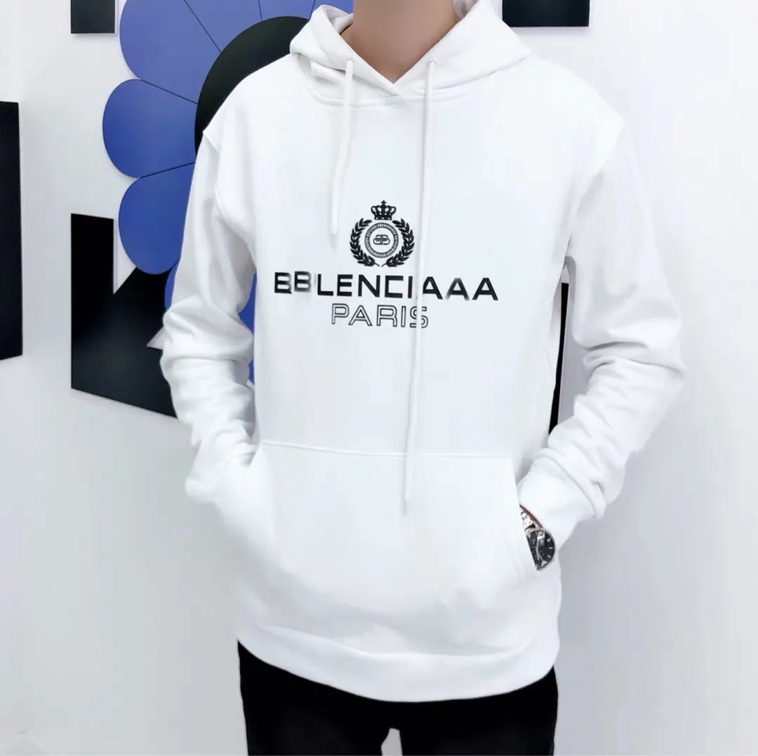 ♻️💯Reference model picture of the upper body❤️Spring and autumn style Balenciaga classic wheat ear hooded sweatshirt. Selected 480g cotton double yarn terry fabric, thick and textured, high-density knitting weaving technology, tight and elastic, extremely soft and skin-friendly, soft and delicate feel, no shrinkage or deformation, the upper body is crisp and stylish, different from the cheap soft couch fabrics with low weight and low count on the market.  Ultra-high-level workmanship, every detail shows a sense of luxury, and the original three-dimensional cutting process creates a perfect fit. The OS loose shoulder style accommodates all body types. It is a truly versatile style that looks slim and good-looking for both men and women.  The classic wheat ear letter printing on foam rubber has high fastness and will not crack or fall off. The classic pattern will never go out of style. There are many colors to choose from, and every color is beautiful!  Color: White Size: XS-L P:410