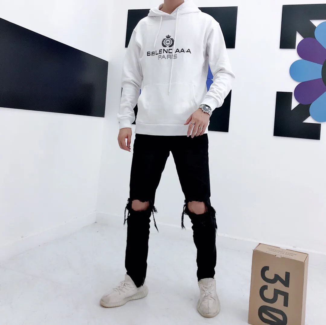♻️💯Reference model picture of the upper body❤️Spring and autumn style Balenciaga classic wheat ear hooded sweatshirt. Selected 480g cotton double yarn terry fabric, thick and textured, high-density knitting weaving technology, tight and elastic, extremely soft and skin-friendly, soft and delicate feel, no shrinkage or deformation, the upper body is crisp and stylish, different from the cheap soft couch fabrics with low weight and low count on the market.  Ultra-high-level workmanship, every detail shows a sense of luxury, and the original three-dimensional cutting process creates a perfect fit. The OS loose shoulder style accommodates all body types. It is a truly versatile style that looks slim and good-looking for both men and women.  The classic wheat ear letter printing on foam rubber has high fastness and will not crack or fall off. The classic pattern will never go out of style. There are many colors to choose from, and every color is beautiful!  Color: White Size: XS-L P:410