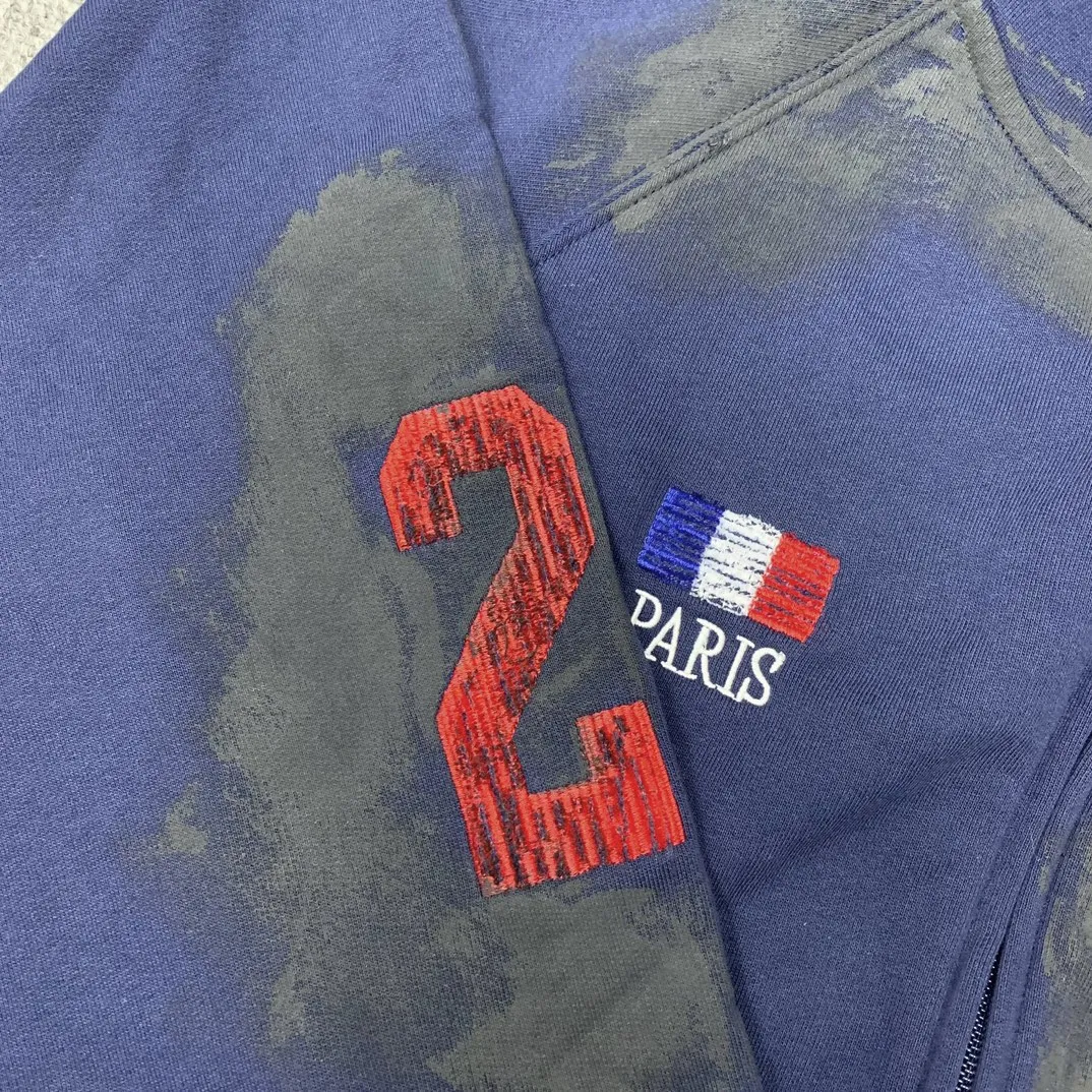 Details added————The top tested version Balenciaga Paris co-branded Lauren Raff mustang war horse embroidered flag muddy distressed dirty zipper cardigan sweatshirt #custom-woven Paris fabric 480g. The zipper is matched with a custom logo. Imported Tajima machines are used to embroider large-area heavy-duty high-density embroidery effects to make the embroidery more three-dimensional. The back is printed with imported glue. The ready-made garments are hand-ground and irregularly applied with mud to create a mud effect. Each piece of clothing needs to be coated three times, with an hour's interval between each coat to allow the coating to dry completely to ensure that the printing will not stick together. Exclusive and high quality due to heavy work and time consuming labor.   Color: Dark Blue Size: XS-L P:510