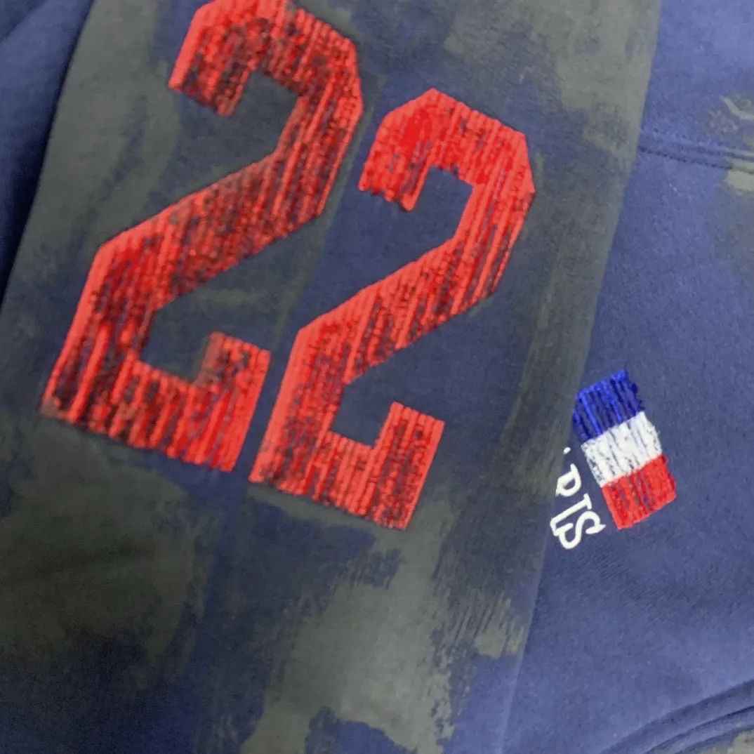 Details added————The top tested version Balenciaga Paris co-branded Lauren Raff mustang war horse embroidered flag muddy distressed dirty zipper cardigan sweatshirt #custom-woven Paris fabric 480g. The zipper is matched with a custom logo. Imported Tajima machines are used to embroider large-area heavy-duty high-density embroidery effects to make the embroidery more three-dimensional. The back is printed with imported glue. The ready-made garments are hand-ground and irregularly applied with mud to create a mud effect. Each piece of clothing needs to be coated three times, with an hour's interval between each coat to allow the coating to dry completely to ensure that the printing will not stick together. Exclusive and high quality due to heavy work and time consuming labor.   Color: Dark Blue Size: XS-L P:510