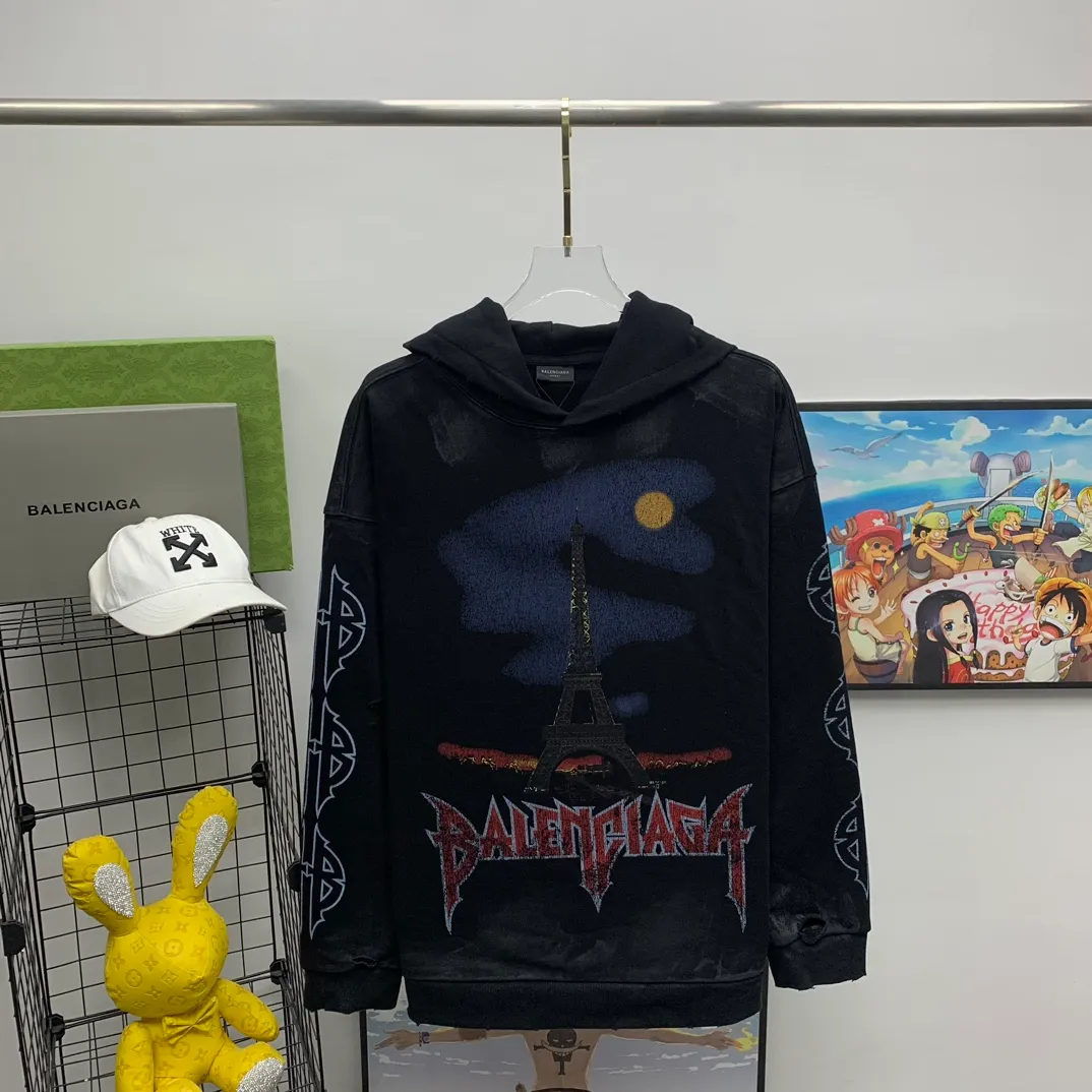 Top tested version BALENCIAGA Tower Paris Night Balenciaga distressed, dirty, hole-washed hooded sweatshirt YB1.3W purchase ➕ price 10K purchase original directional development! 460g double-ply double-yarn terry fabric, the garment weight is as high as 1.2kg! The back printing adopts Kornit digital direct printing process, and the shipment is extremely slow! Especially the Yunmu color on the tower is very delicate and grainy! The overall bursting letters are very evenly distressed and have a full sense of distress! The whole body was severely damaged, all randomly worn by hand! Very time consuming! The whole piece of clothing went through three washes. The fabric was first pre-shrunk, and then washed with distressing water to wash out the color on the printed surface to give it a distressed look. After washing with water for the second time, do the dirty coating. The staining is also a manual process, and each position of the coating must be brushed more than 3 times before! The key point is the coating on the back. It is a process that really makes people vomit blood. It has to be brushed back and forth, more than 20 times, to evenly apply the coating! It can be said that it will never be seen alive. After the coating is completed, the garments will be sprayed and then washed with wax! After washing with the wax, the fabric feels smooth and won't have that harsh, rough feel! This is also a key craft! If this step is missing, it won’t be visible on the screen, but it will be very uncomfortable and the skin texture will be very poor!  The workmanship is troublesome, and it normally takes 15 days for orders to be returned! Look at this construction period and this price, do you think it’s worth it?  Size: XS-L Color: Active Black P:470