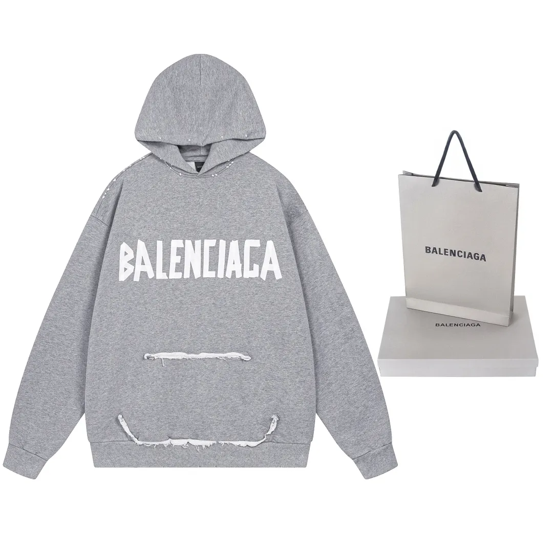 🅿️400 real photos. Note: Floral gray ❗️ [Top version. Official website quality] BALENCI*GA/Paris. 23ss latest classic hot style. Purchase the original board at the first time. Color. Printing. Washing. Production can be traced back to the original product. Wrong version in the market. Welcome to compare. Tape direct printing. Ready-to-wear hooded sweatshirt washed and worn twice. The brick cabinet is synchronized. The fabric is made of Paris ZP custom-woven and dyed cotton sweatshirt. The weight is 450 grams. The cloth surface is clean. The cloth pattern is clear, soft and comfortable, and the threads are dyed with no color difference. The classic pattern adopts Kornit imported direct injection. The letters are clear and the effect is three-dimensional. Restored brick cabinet. The garments were washed and aged, and polished by many hands. Produced by ultra-heavy craftsmanship, special market currency. Note⚠️ZP fabric is made of fine-grained yarn. Pay attention to the big difference! Welcome to compare! The version adopts OS loose shoulder version. The same style for men and women. Code: BL238016 Color: dark gray blue, Paris blue, washed black, burgundy, fluorescent yellow, green, floral gray, sky blue, khaki Size: XS S M L