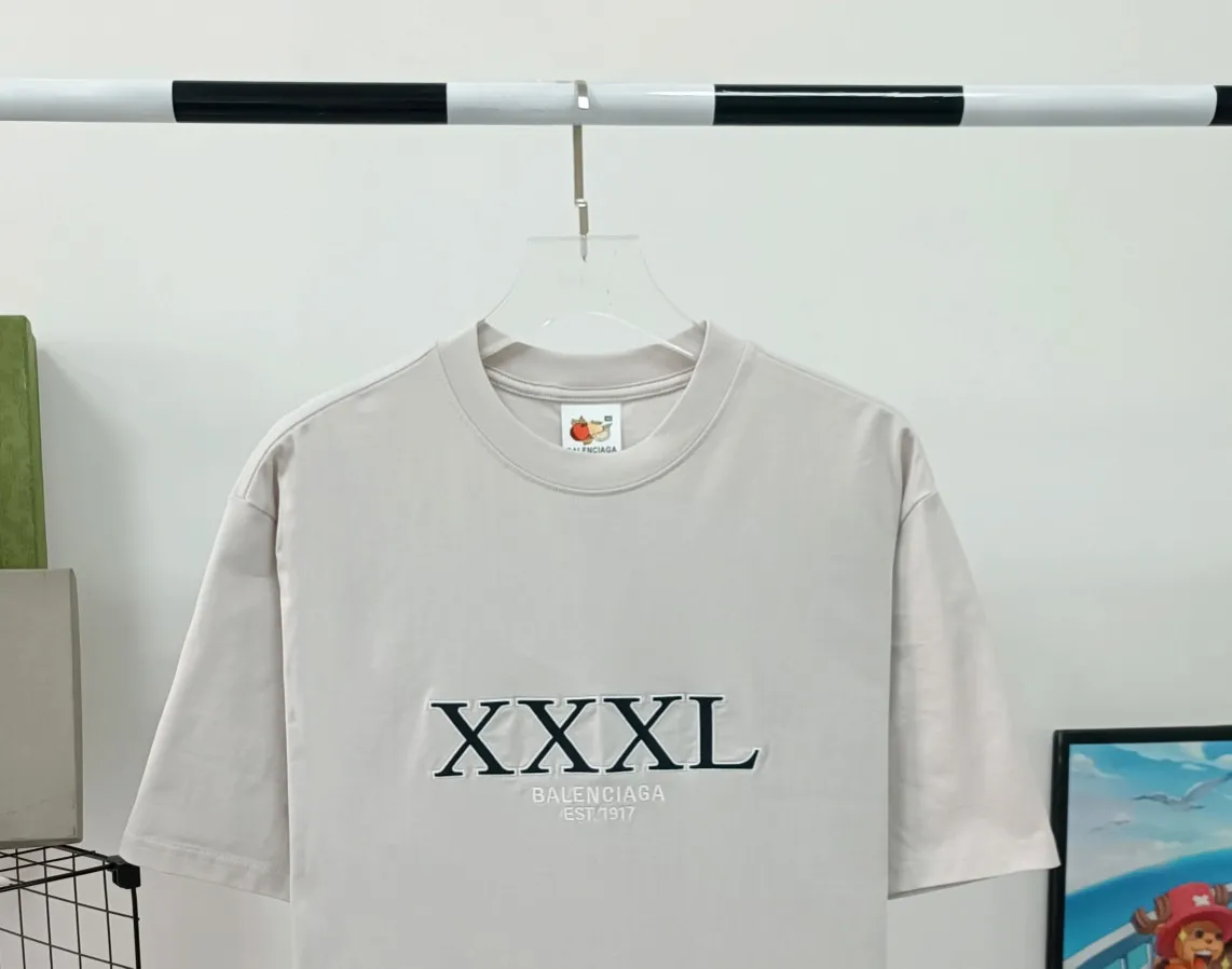 The top tested version of Balenciaga BALENCIAGA's new XXXL letter embroidery, milky white latest style bottoming short-sleeved T-shirt [new ceiling level] - 2023 new version shipped! Feel free to compare top quality products!  -Using imported Tajima 10w needle machine embroidery, high-density embroidery letter wrapping technology, full details and no tails, clear letters without connections‼ ️ - BLCG's latest fashion series, Jay Chou's same upper body, new models are released every year, milk white color is new this year, I didn't hesitate to buy it as soon as I saw it, the upper body is whiter, I love this color so much! The new customized fruit pattern collar label is different from the previous embroidered LOGO collar label, please pay attention to the distinction! -Full set of 1:1 customized accessories + Sydney paper with logo + new version of handbags at the counter + three labels for large products + original hangtag -The webbing on the back collar extends to the shoulders for reinforcement, and the stitches are downturned at the joints. Imported elliptical machine with imported glue technology. Overall printing without teeth. 32s280g double yarn combed cotton fabric, weighing up to 400 grams after washing!  Color: Washed Black Apricot Size: XS-L P:310