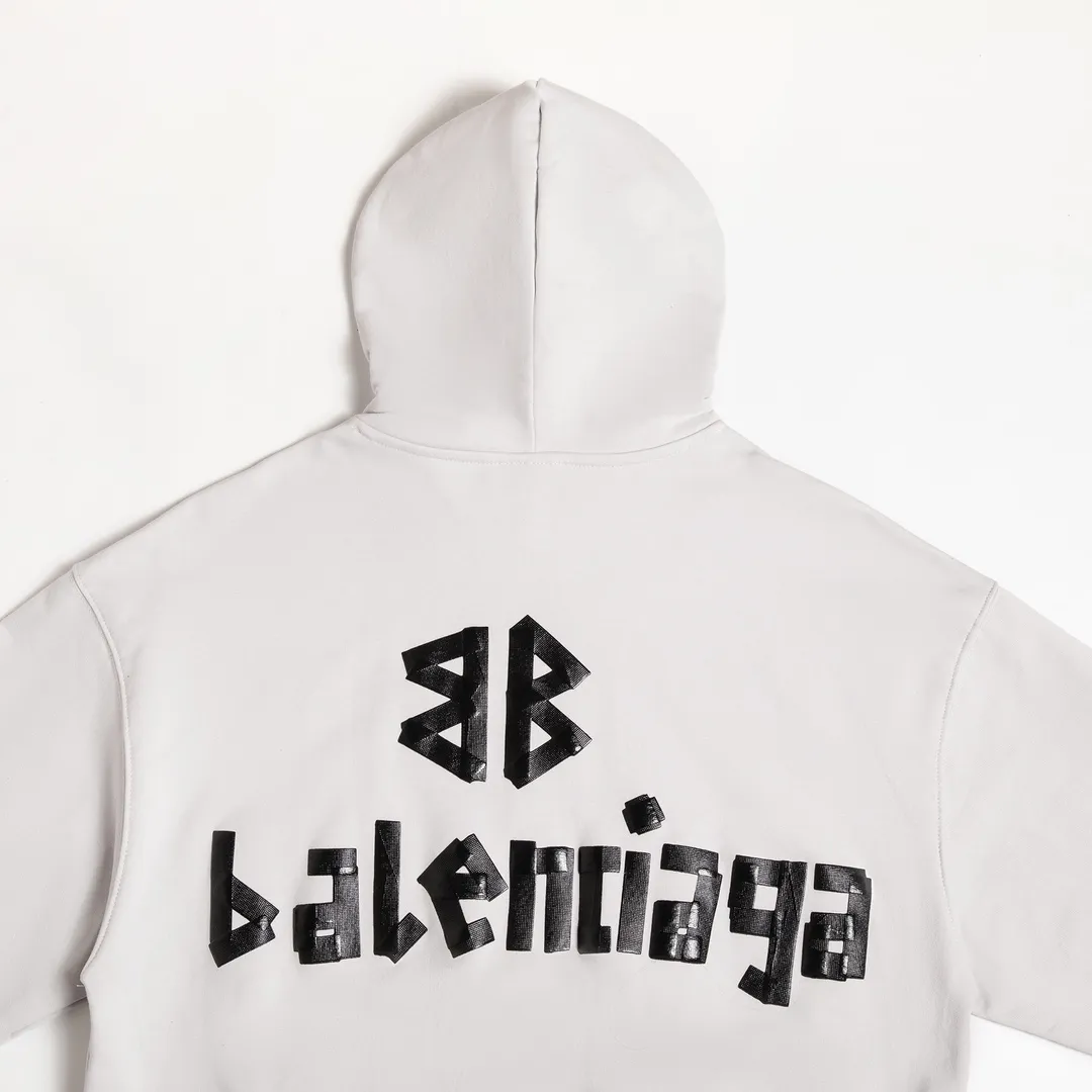 🅿️310 7110# Detailed picture Top version [BALENCIA*GA] Official website quality Paris new tape series hooded sweatshirt OS version Loose dropped shoulders Unisex style Fabric: 480g 100% cotton terry sweatshirt Process: Front and back printing Garment wash Worn Distressed Shape solid color Color: black blue off-white Size: XS S M L