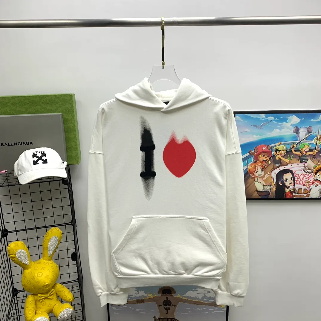 The top tried and tested version of BALENCIAGA's love ❤️printed male and female couple star's same style pullover hoodie sweatshirt. Decorated with I ❤️art work embroidery on the front｜brand logo embroidery on the lower back｜distressed effect. Heavy 480g pure cotton terry fabric, full of feel. The weight of the ready-made clothes is more than one kilogram, and the drape is very good! The new plate-making process that imitates hand embroidery has the rough feel of hand embroidery, and the stitching method is adjusted according to the original pattern. After embroidery, the stitching technique is imitated by hand embroidery, and the smooth curves highlight the embroidery effect.  The main body of the logo pattern is precision stitched; the embroidery is very fine and dense. Linen embroidery thread is used combined with dense processing to increase the three-dimensional effect, and the embroidery body has a subtle matte visual texture. Color: washed black white Size: S--XL P:390