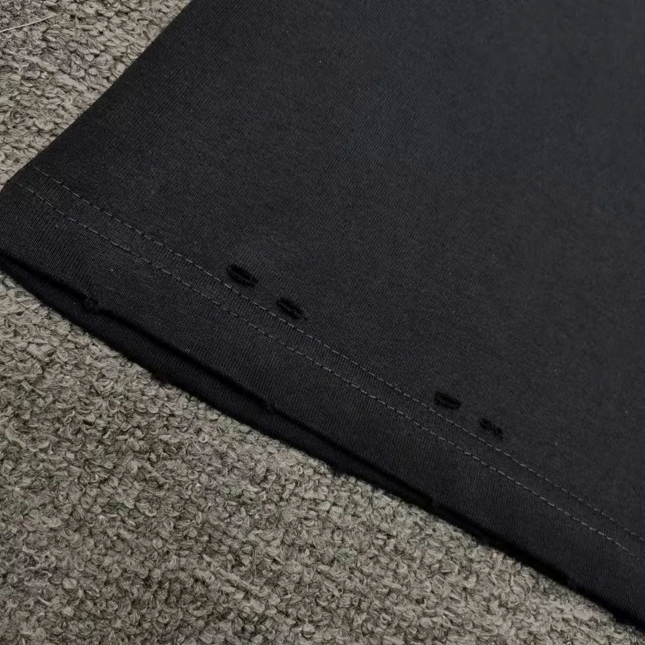 Top version BALENCIAGA/Paris. 2025 new dissolving letter brick cabinet synchronized. Genuine product developed at the first time, happy to print and compare! The fabric is made of Paris ZP custom-woven and dyed cotton with double yarn. Weighing 260 grams, the cloth surface is clean. The cloth pattern is clear, soft and comfortable. The threads are dyed with no color difference. The embroidery uses imported Tajima embroidery machines. The letters are clear and the effect is three-dimensional. The entire garment is worn and distressed. The version adopts OS loose shoulder design. Same style for men and women. Color: black. White. Size: XS S M L P: 290