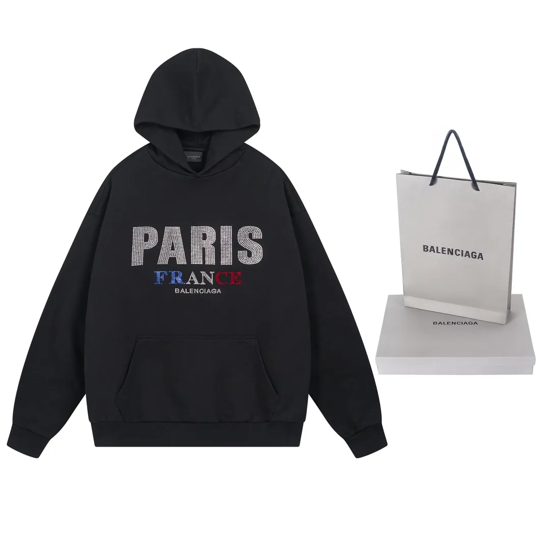 🅿️310 Actual pictures [Top version. Official website quality] BALENCI*GA/Paris BALENCI*GA# new model, with paris. Stress art wood work on the front and rhinestoned hooded sweatshirt on the front. . Brick cabinet synchronization. The fabric is made of Paris ZP custom-woven and dyed cotton terry sweatshirt. The weight is 460 grams. The cloth surface is clean. The cloth pattern is clear. It is soft and comfortable. It has good color fastness and is not easy to change color. The threads are woven and dyed with no color difference. The front hot diamond is made of imported Austrian diamond, which has good gloss and is not easy to fall off. Comparisons welcome. Restore brick cabinet. The version adopts OS loose shoulder style. Same style for men and women. Code: BL238922 Color: Black Size: XS S M L