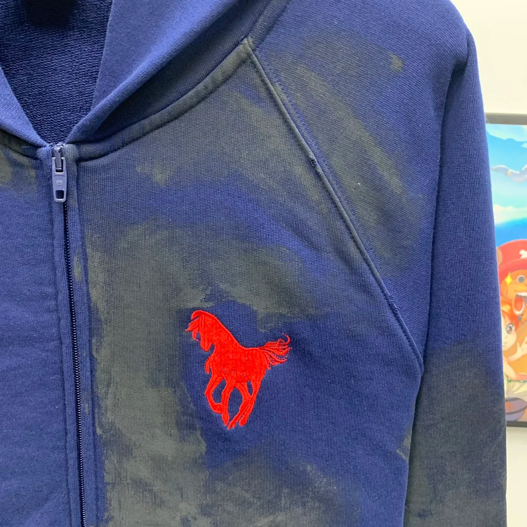 Top tested version Balenciaga Paris co-branded Lauren Raff mustang war horse embroidered flag muddy old dirty zipper cardigan sweatshirt #custom-woven Paris fabric 480g. The zipper is matched with a custom logo. Imported Tajima machines are used to embroider large-area heavy-duty high-density embroidery effects to make the embroidery more three-dimensional. The back is printed with imported glue. The ready-made garments are hand-ground and irregularly applied with mud to create a mud effect. Each piece of clothing needs to be coated three times, with an hour's interval between each coat to allow the coating to dry completely to ensure that the printing will not stick together. Exclusive and high quality due to heavy work and time consuming labor.   Color: Dark Blue Size: XS-L P:510