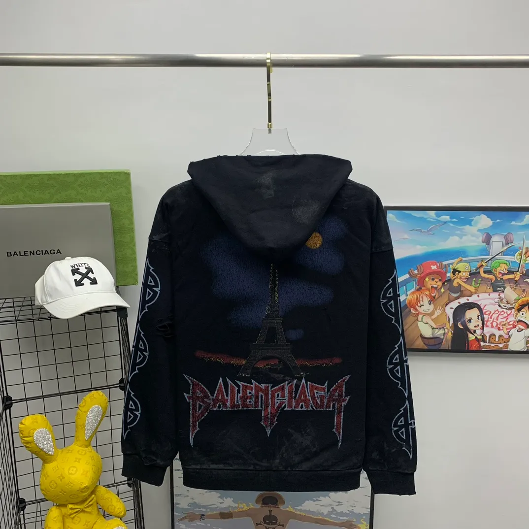 Top tested version BALENCIAGA Tower Paris Night Balenciaga distressed, dirty, hole-washed hooded zipper hoodie sweatshirt YB1.3W purchase ➕ price 10K purchase original directional development! 460g double-ply double-yarn terry fabric, the garment weight is as high as 1.2kg! The back printing adopts Kornit digital direct printing process, and the shipment is extremely slow! Especially the Yunmu color on the tower is very delicate and grainy! The overall bursting letters are very evenly distressed and have a full sense of distress! The whole body was severely damaged, all randomly worn by hand! Very time consuming! The whole piece of clothing went through three washes. The fabric was first pre-shrunk, and then washed with distressing water to wash out the color on the printed surface to give it a distressed look. After washing with water for the second time, do the dirty coating. The staining is also a manual process, and each position of the coating must be brushed more than 3 times before! The key point is the coating on the back. It is a process that really makes people vomit blood. It has to be brushed back and forth, more than 20 times, to evenly apply the coating! It can be said that it will never be seen alive. After the coating is completed, the garments will be sprayed and then washed with wax! After washing with the wax, the fabric feels smooth and won't have that harsh, rough feel! This is also a key craft! If this step is missing, it won’t be visible on the screen, but it will be very uncomfortable and the skin texture will be very poor!  The workmanship is troublesome, and it normally takes 15 days for orders to be returned! Look at this construction period and this price, do you think it’s worth it?  Size: XS-L Color: Active Black P:490