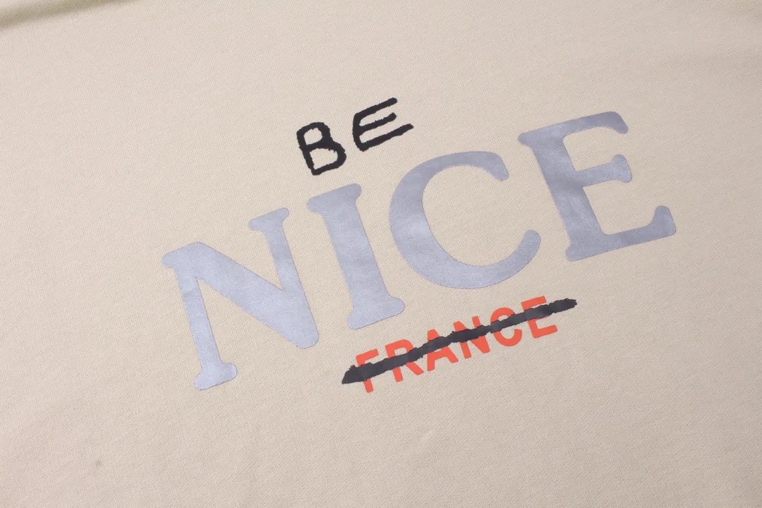 🅿️316 real photos [Top version. Official website quality] BALENCI*GA/Paris BALENCI*GA#NICE letter printed hooded sweatshirt. New product for autumn and winter 2023. Purchase the original board for the first time to customize. Color printing. Washed and worn to be consistent with the original board. Welcome to compare. Brick cabinet synchronization. The fabric is made of Paris ZP custom-woven and dyed cotton double-yarn large parka. The weight is 450 grams. The cloth surface is clean. The cloth pattern is clear. It is soft and comfortable. It has good color fastness and is not easy to change color. The threads are woven and dyed with no color difference. The printing uses a round machine hand-painted effect. No burrs. The color is the same as the original board. The whole piece of clothing is hand-made and worn. The brick cabinet is restored. The version adopts the OS loose shoulder version. Same style for men and women. Code: BL238033 Color: Gray purple. Apricot Size: XS S M L