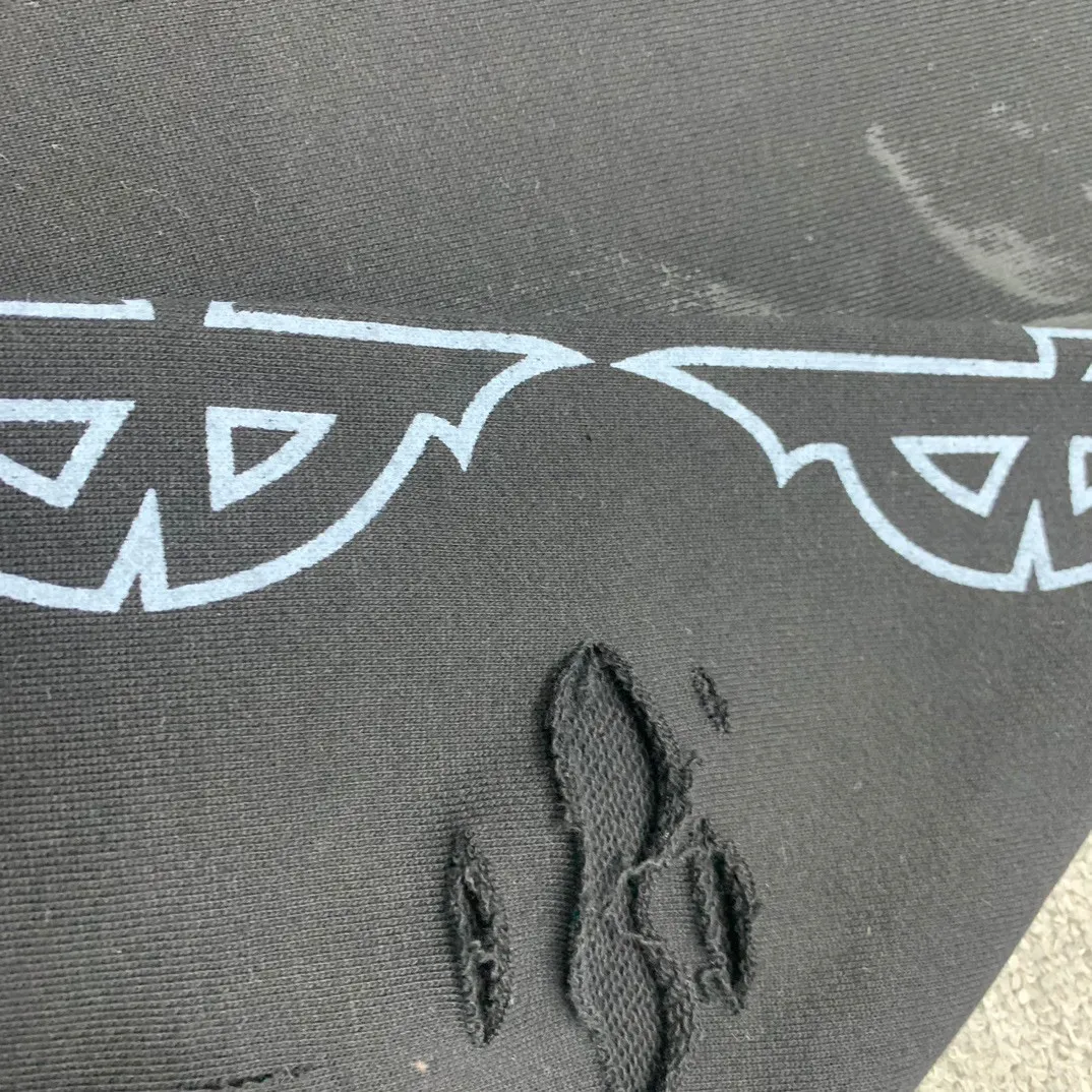 Details added————The top tested version BALENCIAGA Tower Paris Night Balenciaga distressed and dirty hole washed hooded zipper hoodie sweatshirt YB1.3W purchase ➕ price 10K purchase original directional development! 460g double-ply double-yarn terry fabric, the garment weight is as high as 1.2kg! The back printing adopts Kornit digital direct printing process, and the shipment is extremely slow! Especially the Yunmu color on the tower is very delicate and grainy! The overall bursting letters are very evenly distressed and have a full sense of distress! The whole body was severely damaged, all randomly worn by hand! Very time consuming! The whole piece of clothing went through three washes. The fabric was first pre-shrunk, and then washed with distressing water to wash out the color on the printed surface to give it a distressed look. After washing with water for the second time, do the dirty coating. The staining is also a manual process, and each position of the coating must be brushed more than 3 times before! The key point is the coating on the back. It is a process that really makes people vomit blood. It has to be brushed back and forth, more than 20 times, to evenly apply the coating! It can be said that it will never be seen alive. After the coating is completed, the garments will be sprayed and then washed with wax! After washing with the wax, the fabric feels smooth and won't have that harsh, rough feel! This is also a key craft! If this step is missing, it won’t be visible on the screen, but it will be very uncomfortable and the skin texture will be very poor!  The workmanship is troublesome, and it normally takes 15 days for orders to be returned! Look at this construction period and this price, do you think it’s worth it?  Size: XS-L Color: Active Black P:490