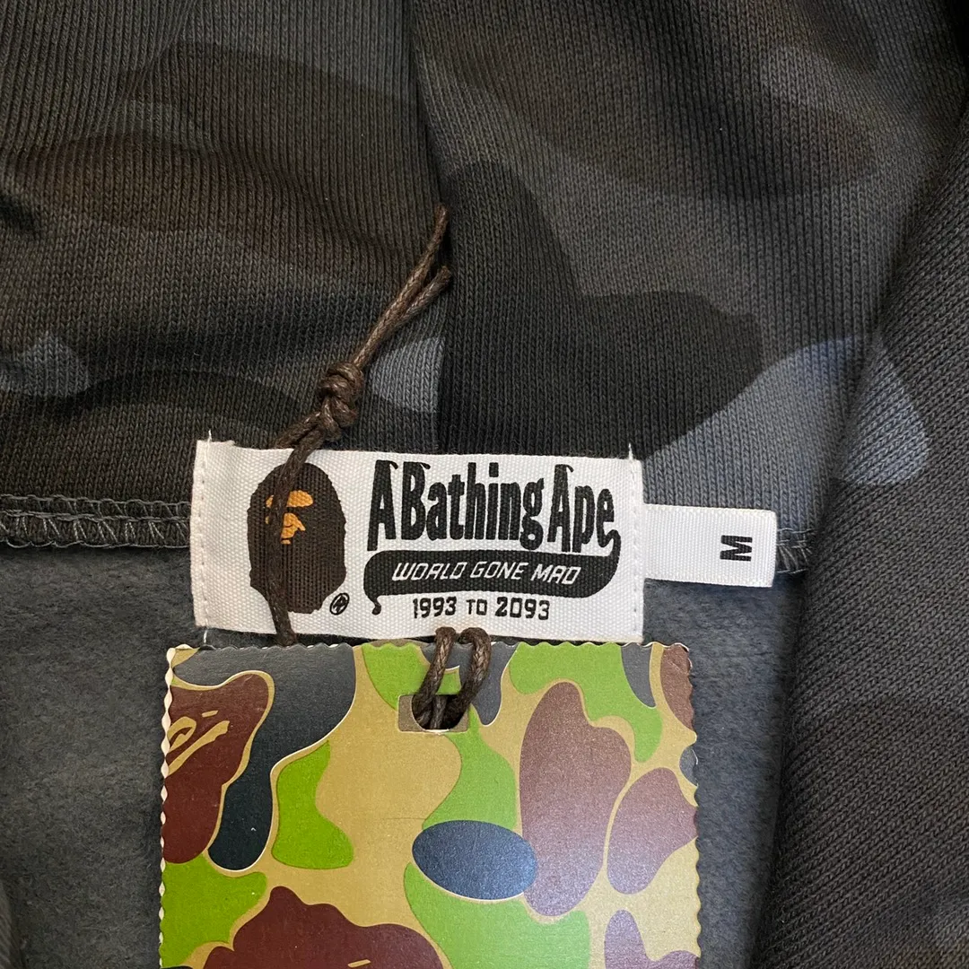 💰380 BAPE 1ST CAMO SHARK FULL Classic counter model Camouflage shark hooded zipper sweatshirt Machine-printed camouflage Top-quality fabric High-end 1:1 replica Customized fabric Couple model: S—XXL [Camouflage yellow, Camouflage green, Camouflage red, Camouflage purple, Camouflage blue, Camouflage gray]