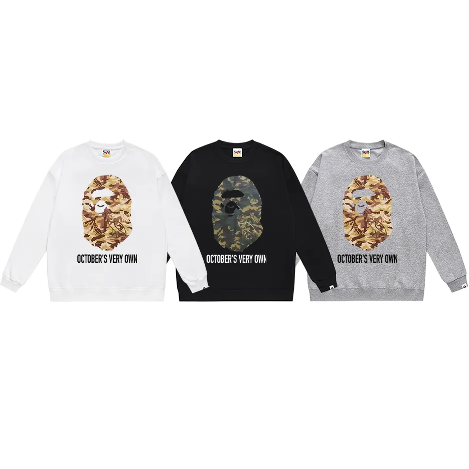 P170 model number SC316# terry 80 plus velvet 85 (top version) BAPE ape head co-branded owl camouflage printed round neck sweatshirt Made of 350 grams of large terry (drop shoulder large version) fabric, soft texture and no pilling Imported environmentally friendly printing glue The pattern is bright and three-dimensional Quality 💥Same style for men and women The upper body is trendy Color: black white gray Size: S M L XL XXL