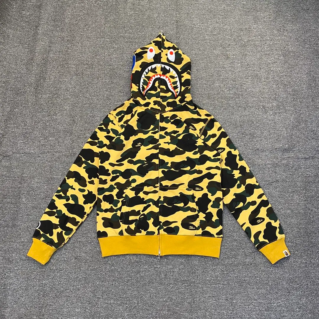 💰380 BAPE 1ST CAMO SHARK FULL Classic counter model Camouflage shark hooded zipper sweatshirt Machine-printed camouflage Top-quality fabric High-end 1:1 replica Customized fabric Couple model: S—XXL [Camouflage yellow, Camouflage green, Camouflage red, Camouflage purple, Camouflage blue, Camouflage gray]